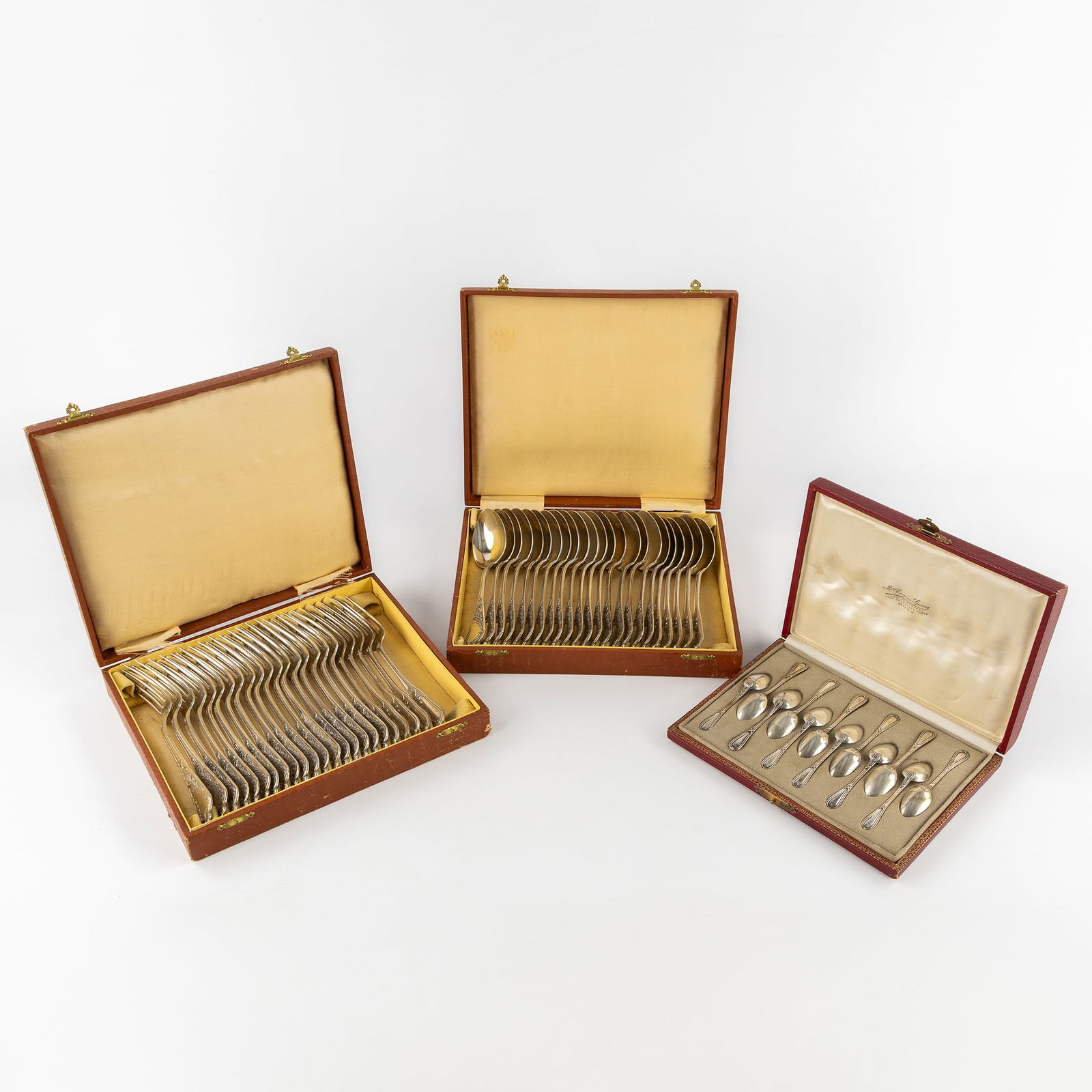 Delheid and Olier & Caron, A Collection of Solid Silver Cutlery. Silver, 3,509kg.: Delheid and Olier & Caron, A Collection of Solid Silver Cutlery. Silver. Silver.23 forks and 23 spoons, in two cases, Louis XV style.Marked Delheid and other.Grade marked A800 for 800/1000 (Belgium,