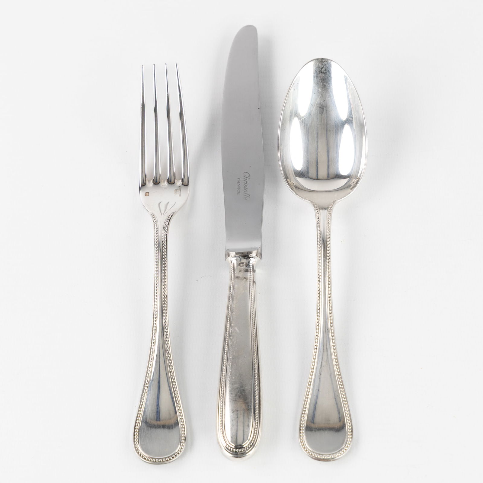 Christofle, Perles, A 36-piece Silver-Plated Cutlery Set.: Christofle, Perles, A 36-piece Silver-Plated Cutlery Set. Silver-plated metal.Perles model. 12 large spoons12 large knives12 large forks Marked Christofle France.