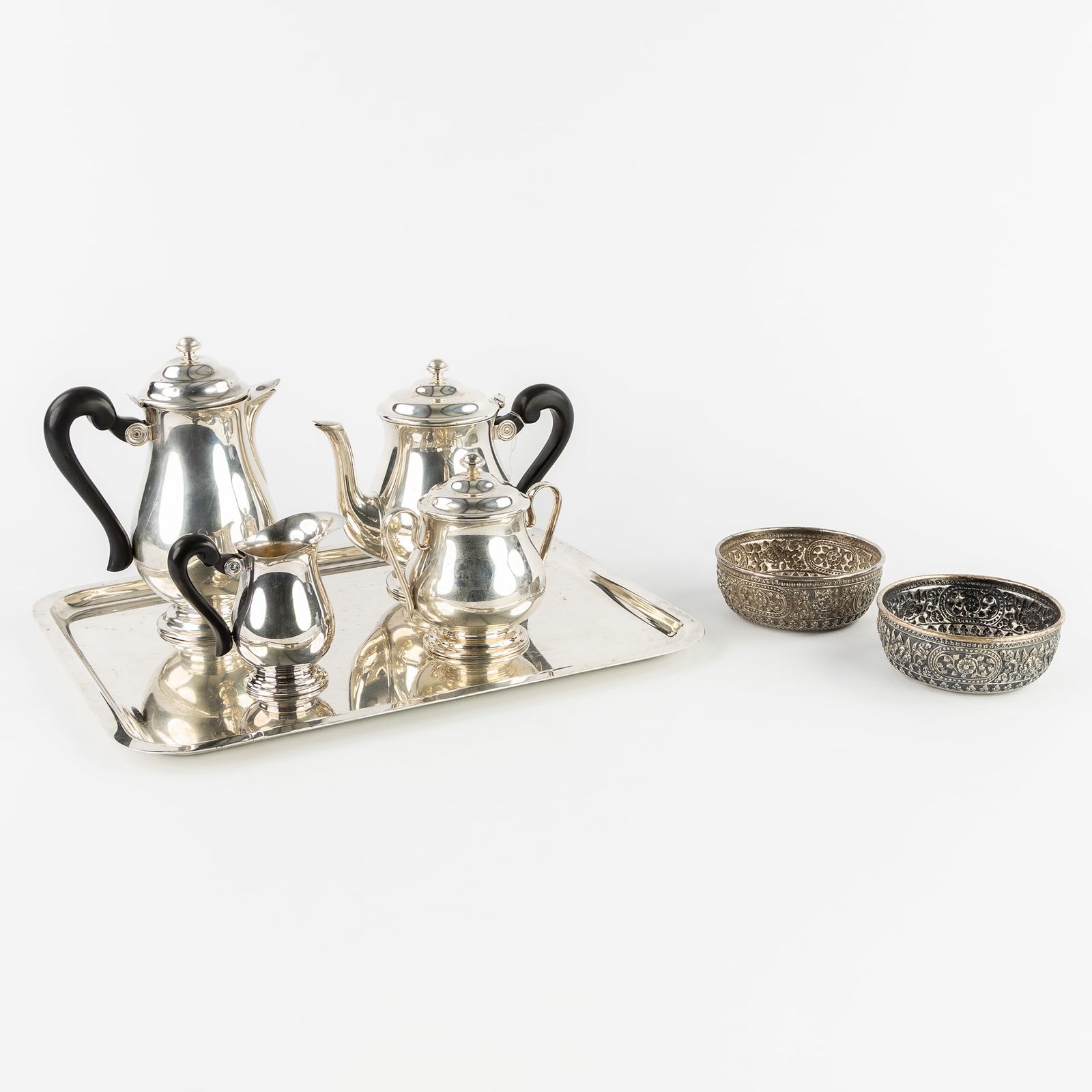 Saint Médard, A Five-piece Coffee and Tea Set, Silver-Plated Metal. Added a Pair of Oriental Silver: Saint Médard, A Five-piece Coffee and Tea Set, Silver-Plated Metal. Added a Pair of Oriental Silver Bowls. Silver. Saint Médard, Vanstahl, silver-plated metal.A 5-piece coffee and tea set with a