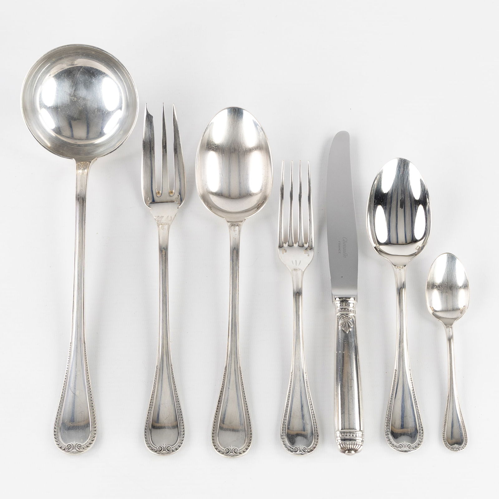 Christofle, Malmaison, A 51-piece Silver-Plated Cutlery Set.: Christofle, Malmaison, A 51-piece Silver-Plated Cutlery Set. Silver-plated metal, Malmaison model.12 large spoons12 large knives12 large forks 12 coffee spoons 1 ladle1 serving fork1 serving spoon