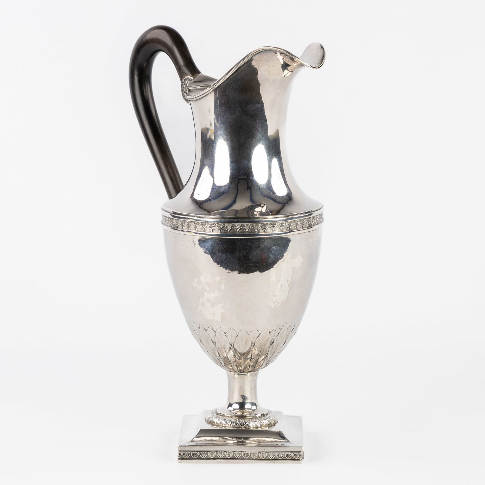 Jean Charles De Beefe (act. 1798-1815) A Solid Silver Ewer, Mechelen/Mechlin, 1809-1819. Silver,: Jean Charles De Beefe (act. 1798-1815) A Solid Silver Ewer, Mechelen/Mechlin, 1809-1819. Silver. A silver ewer with an ebony handle.Empire style. Silver.Grade marked with a provincial Standing