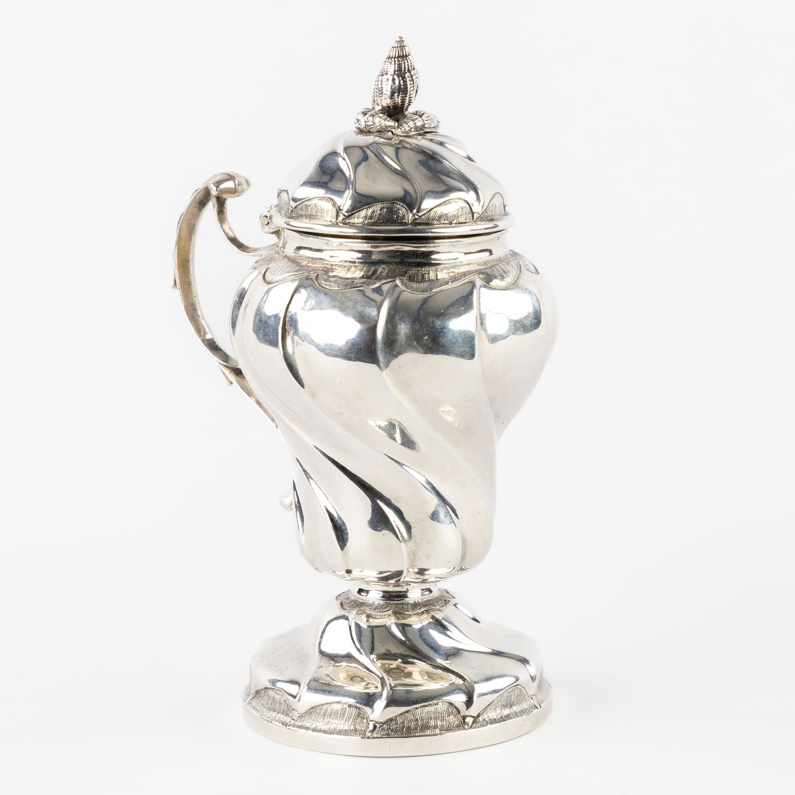 Antoine Sebastien Houtain (act. 1759-1788) A Silver Mustard Pot, Louis XV, Liège, 1766. Silver.: Antoine Sebastien Houtain (act. 1759-1788) A Silver Mustard Pot, Louis XV, Liège, 1766. Silver. A silver mustard pot, decorated with sculptured shells.Louis XV period. Silver.City mark for Liège, wi