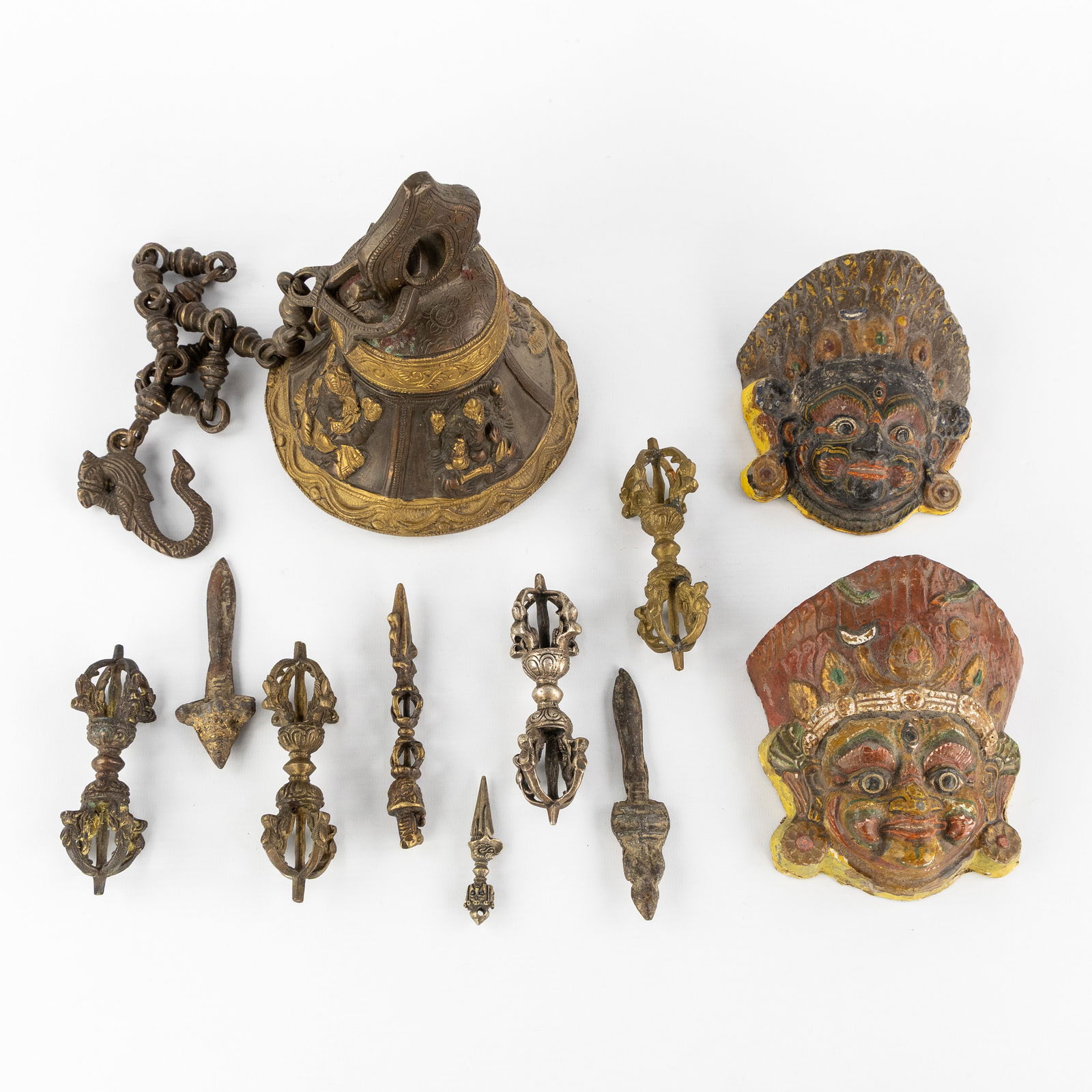 A Collection of 11 Tibetan Ritual Accessories, Vajra, Dorje, Phurba, temple bell and masks. (1 of 6)