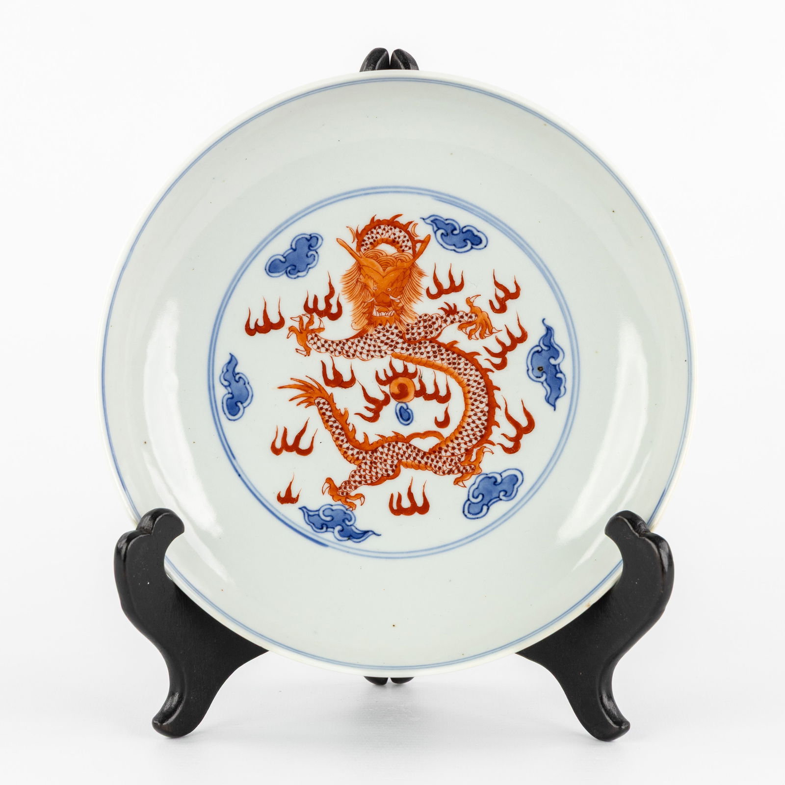 A Chinese blue and white plate with iron-red dragon decoration, marked Qianlong. (1 of 6)