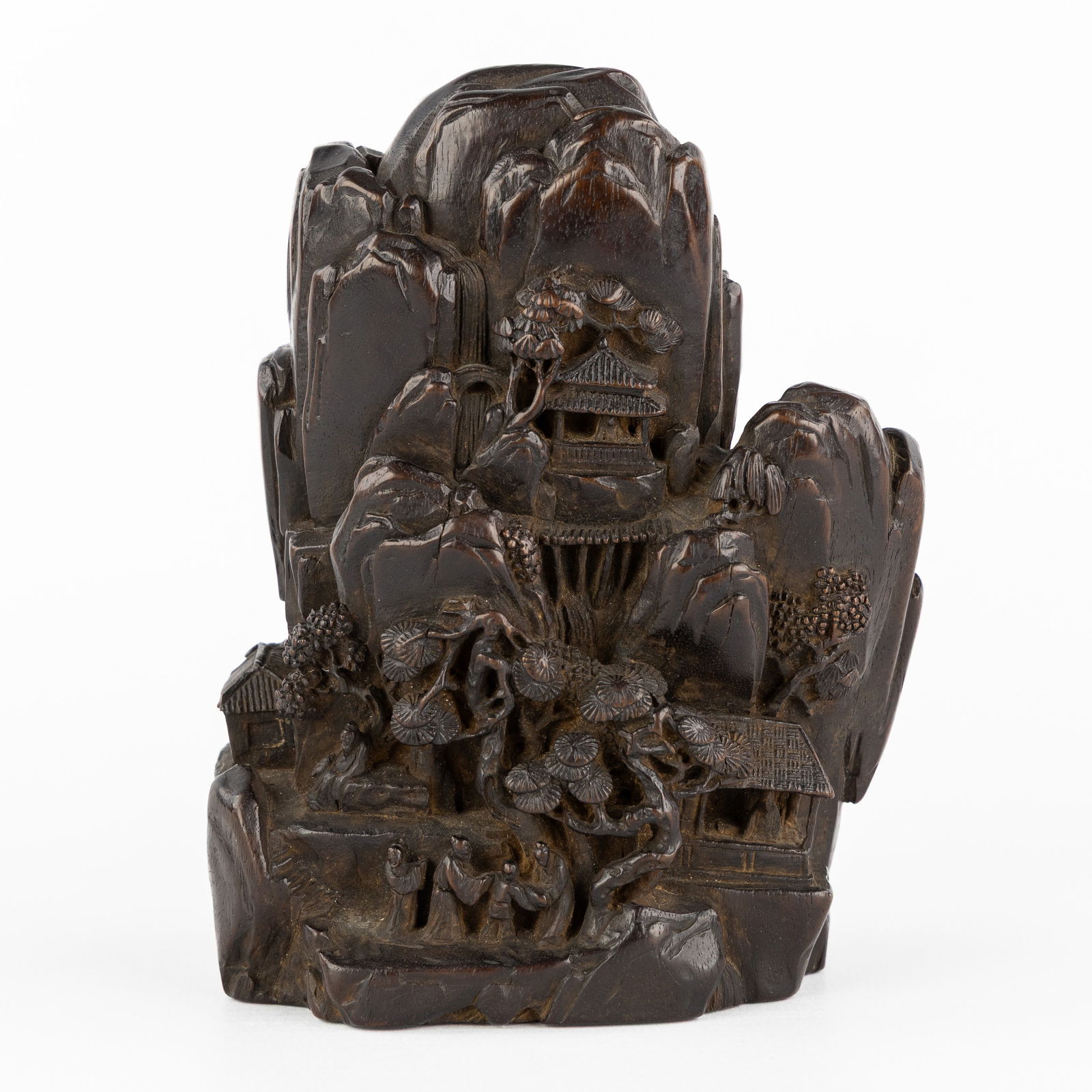 A Finely Sculptured Chinese 'Zitan' rock landscape with pagodas and figurines.: A Finely Sculptured Chinese 'Zitan' rock landscape with pagodas and figurines. Sculptured Zitan wood.Rock landscape with finely sculptured pagodas, figurines (monks), and trees. (10.5 x 14.5 x 7.5 cm)