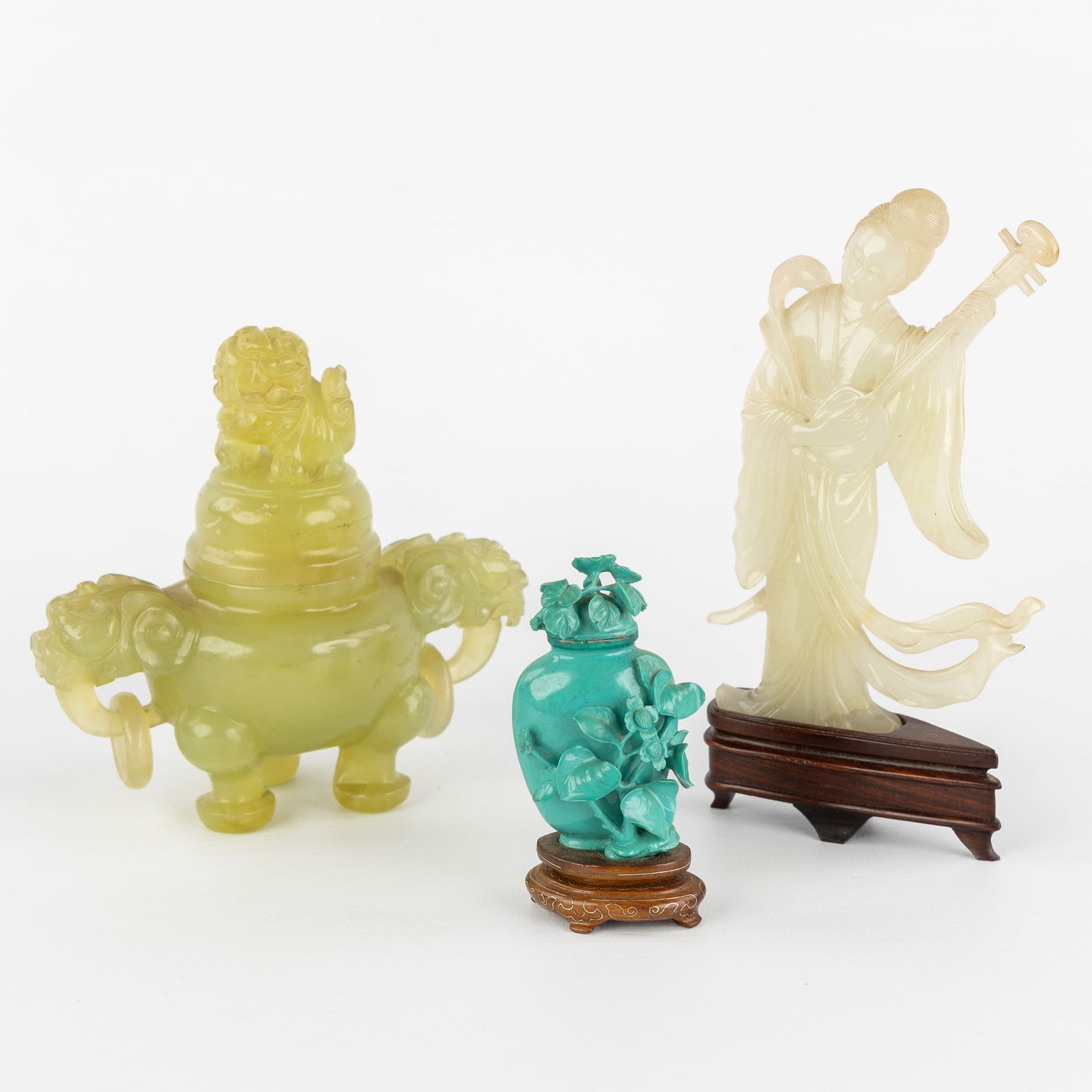 Three Chinese sculptures, Snuff bottle, Lady with Lute and Incense burner, Jade and Turquoise.: Three Chinese sculptures, Snuff bottle, Lady with Lute and Incense burner, Jade and Turquoise. A florally decorated snuff bottle, sculptured turquoise, mounted on a wooden base (H: 9 cm x W: 4 cm x D: