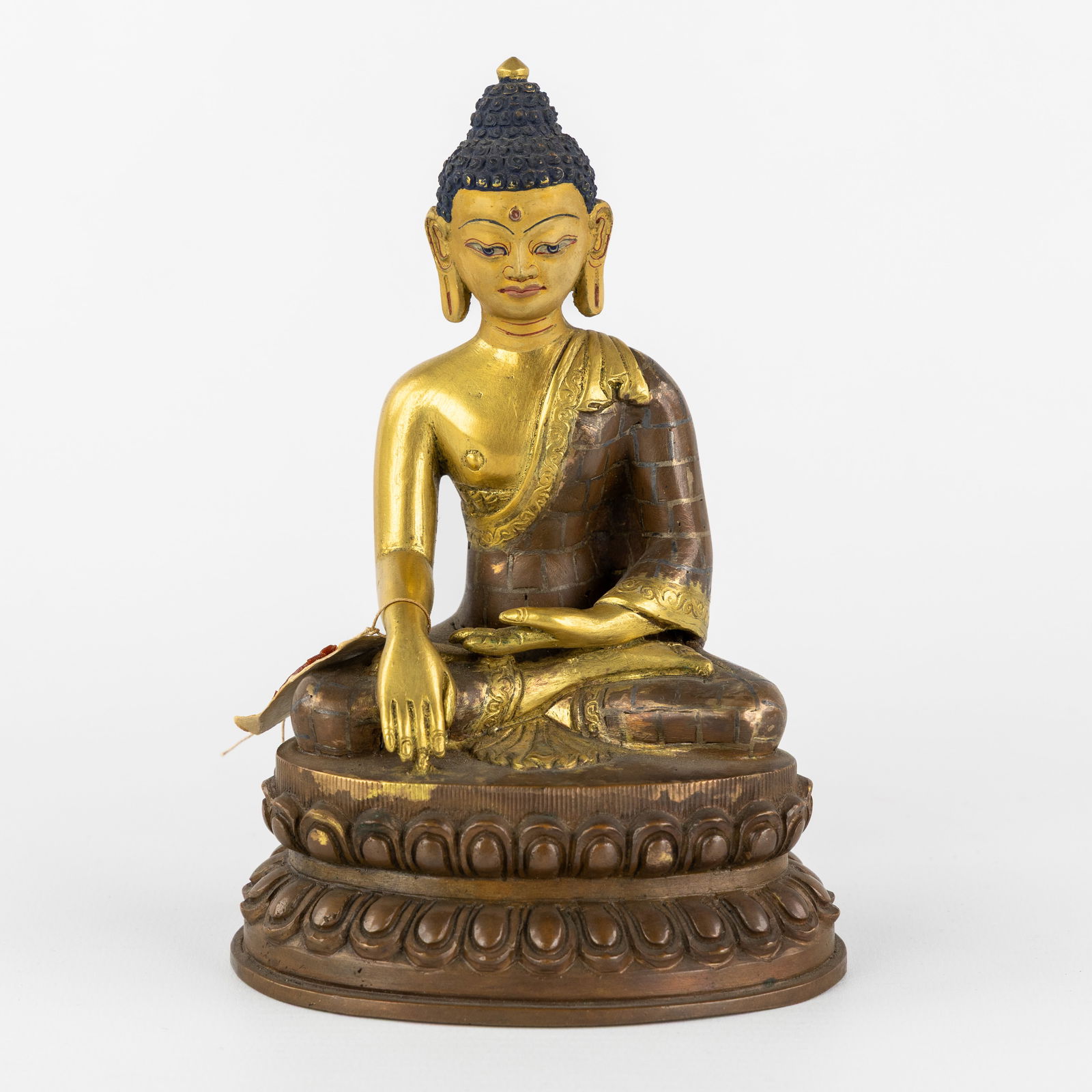 A Seated Shakyamuni Buddha, gilded and patinated bronze, 20th C. (1 of 8)