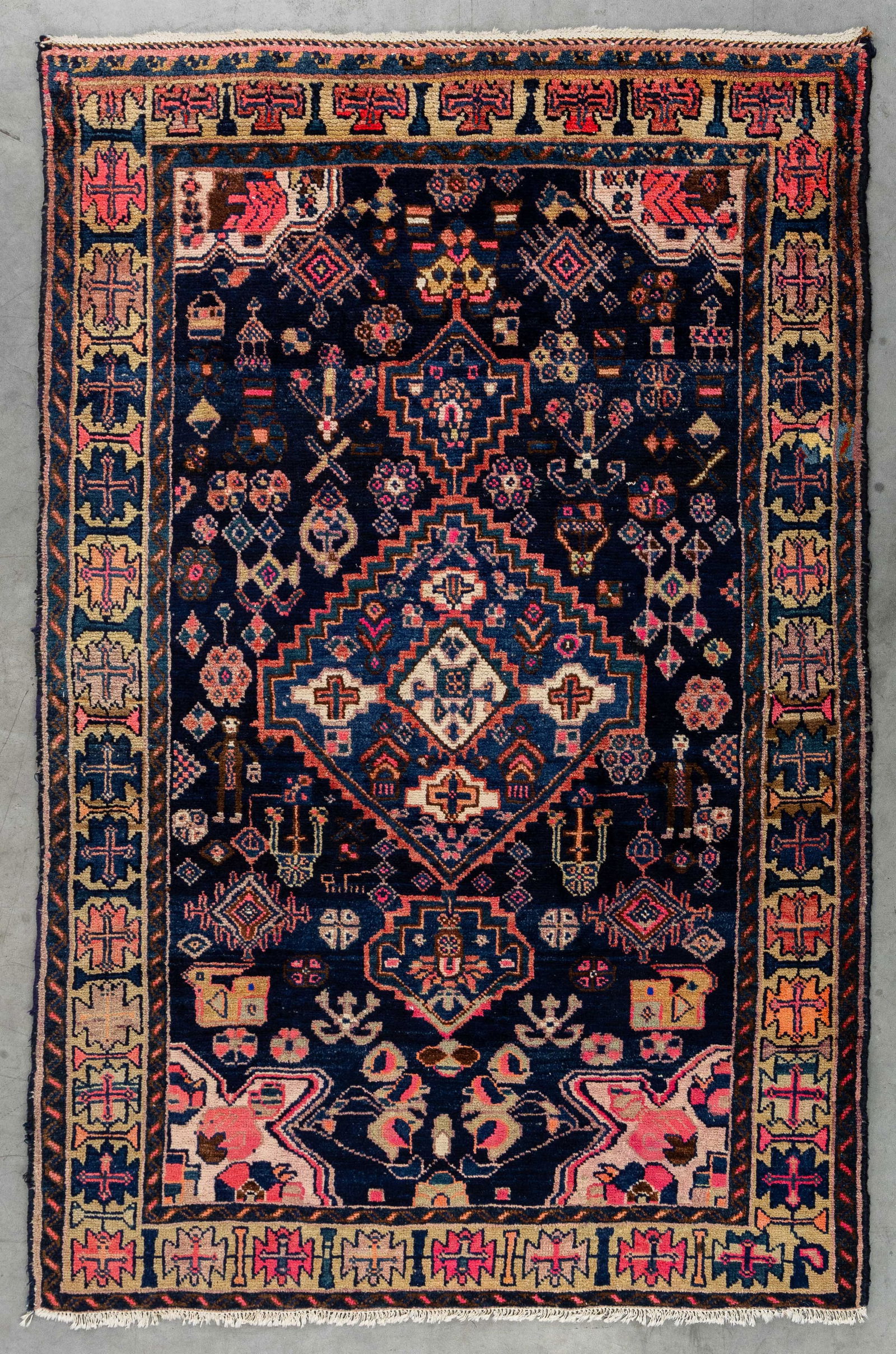 An Oriental hand-made carpet, probably Kazakh (200 x 132 cm). (1 of 5)