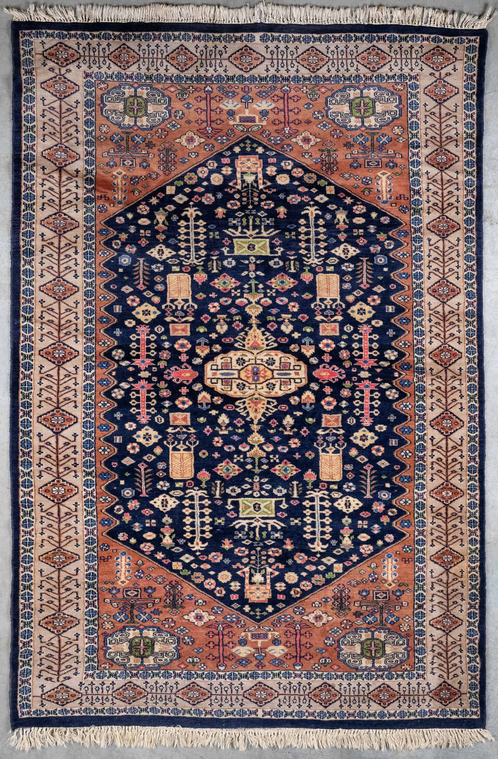 An Oriental hand-made carpet (193 x 133 cm). (1 of 3)
