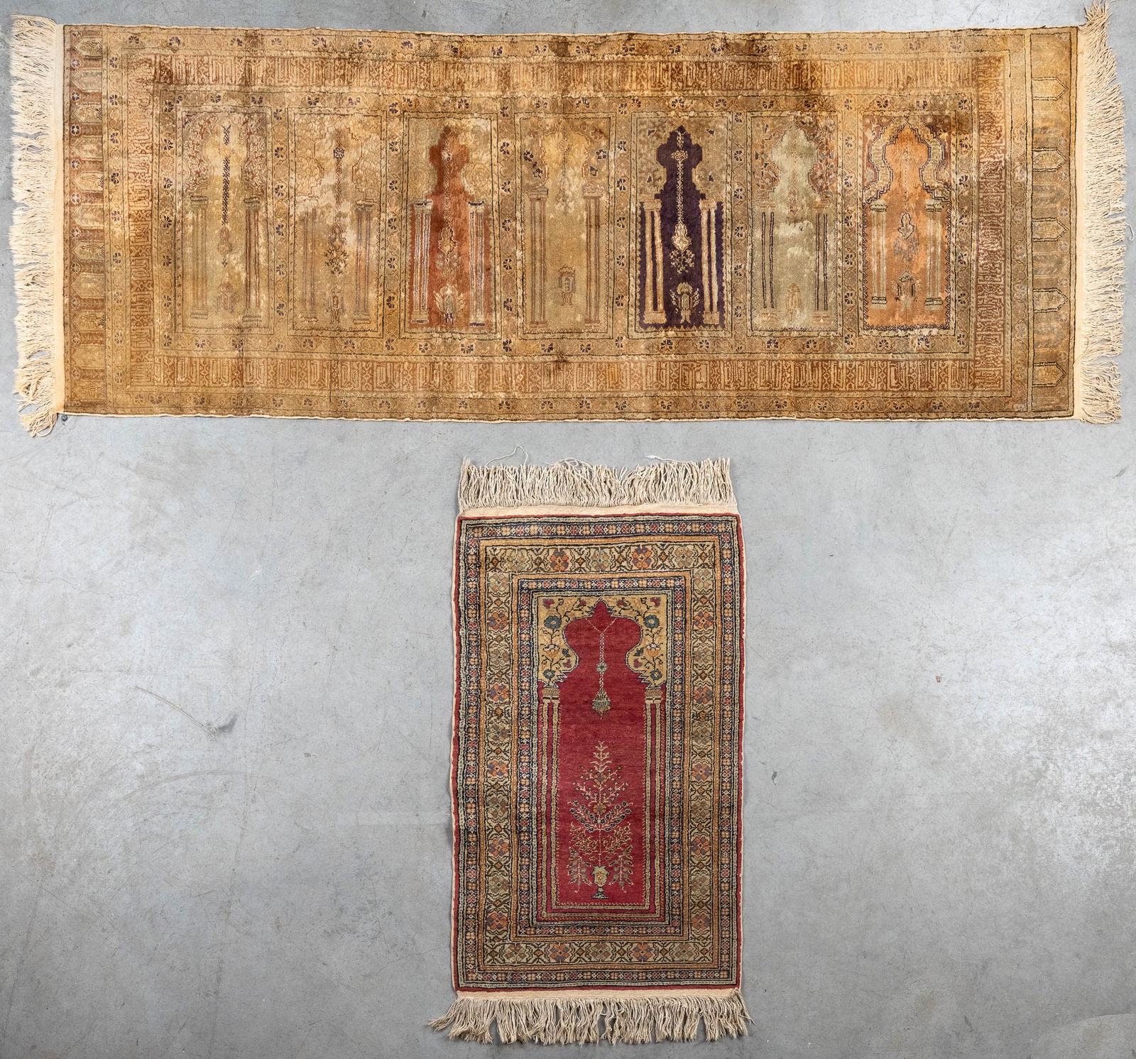 An Oriental hand-made carpet, Kayseri, added a small prayer rug (220 x 82 cm). (1 of 3)
