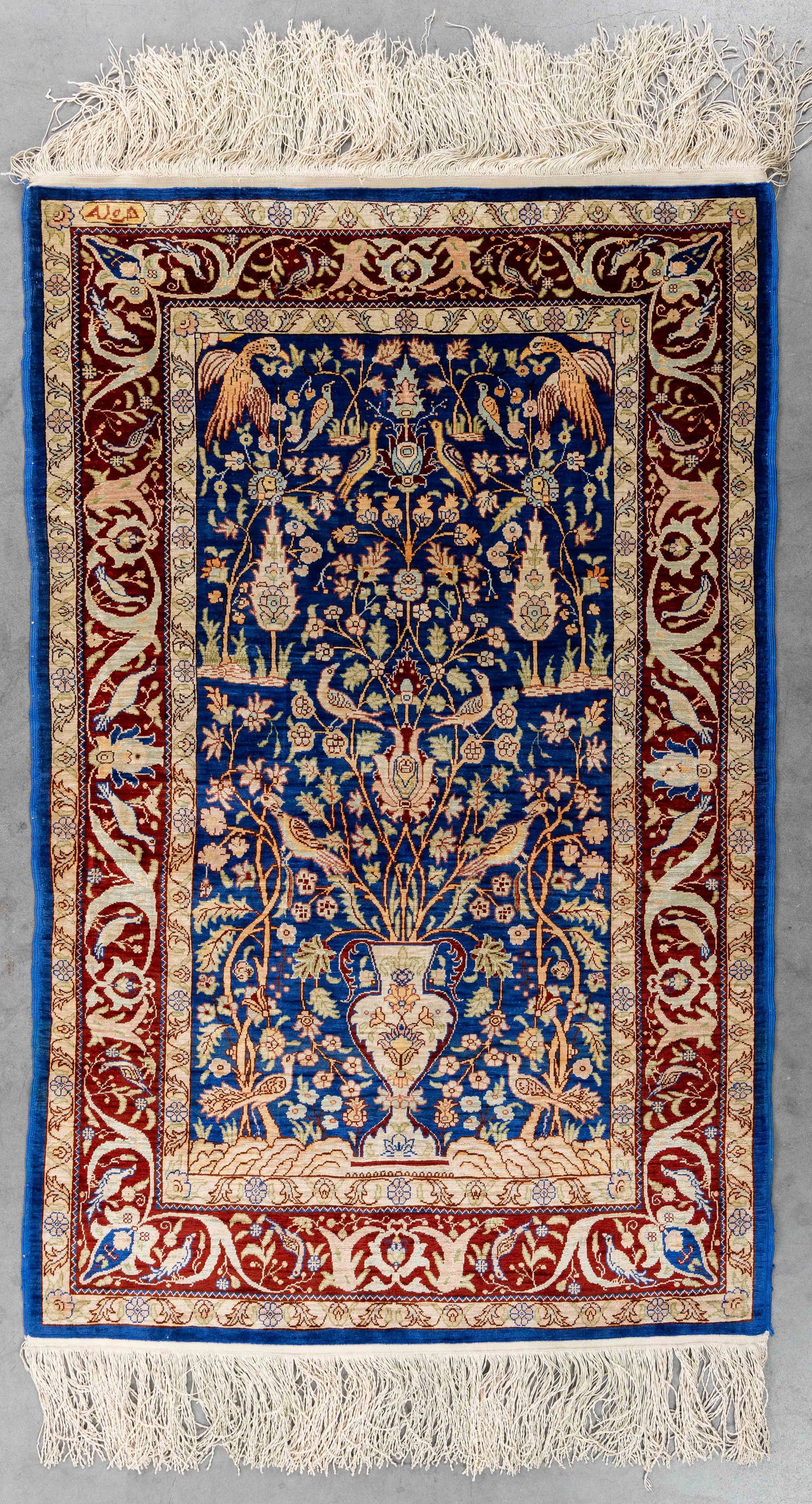 An Oriental hand-made carpet, Silk, Hereke, Turkiye (103 x 68 cm). (1 of 5)