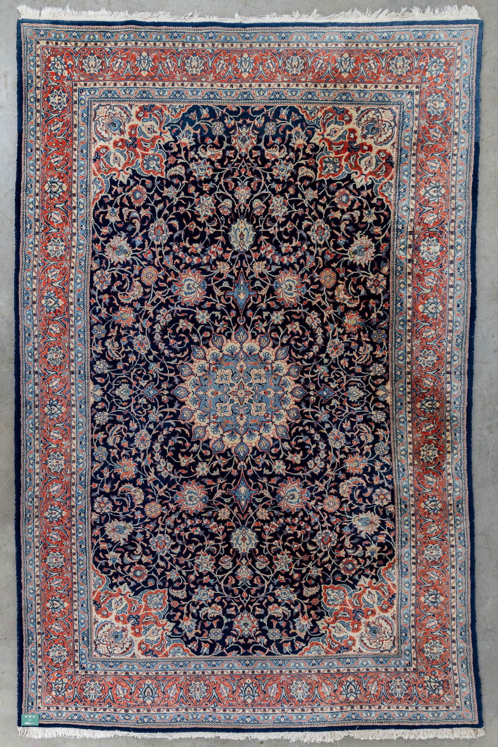 An Oriental hand-made carpet (382 x 226 cm). (1 of 6)