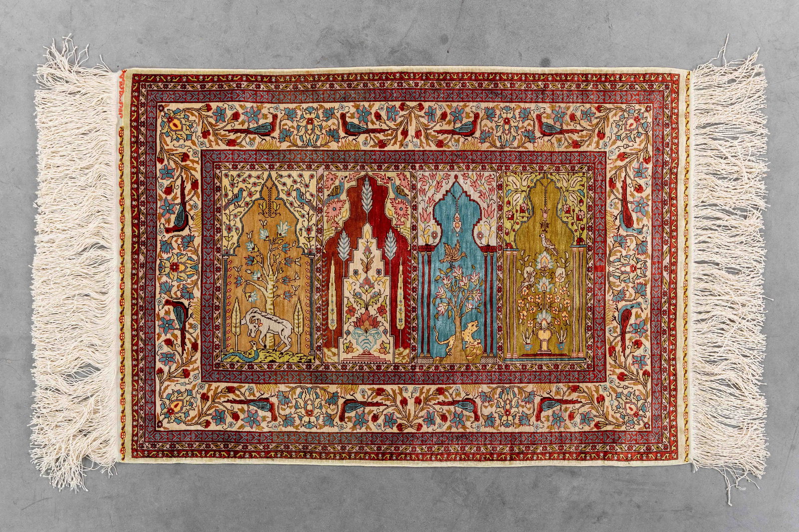 An Oriental hand-made carpet, Silk, Hereke, Turkiye (85 x 59 cm). (1 of 5)