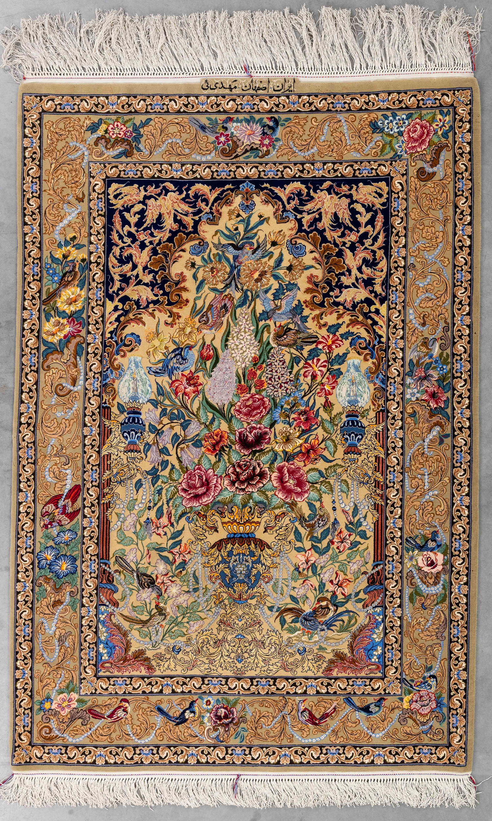 An oriental hand-made carpet, Isfahan, Iran (165 x 111 cm). (1 of 9)