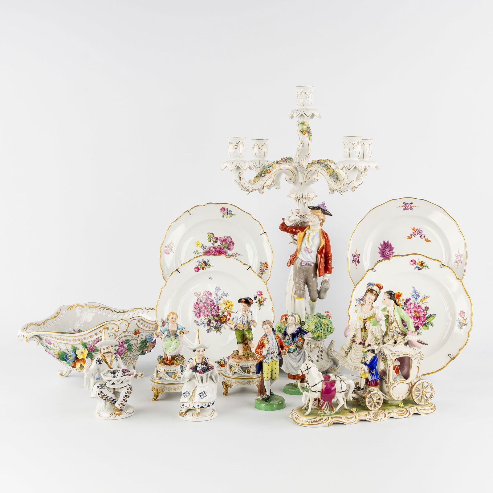 A Collection of porcelain Figurative groups, Plates, Jardinière, and Candelabra. Meissen, Dresden,: A Collection of porcelain Figurative groups, Plates, Jardinière, and Candelabra. Meissen, Dresden, Rudolstadt, Plaue, and others. Polychrome porcelain.A total of 14 pieces.Meissen, plate with a hand