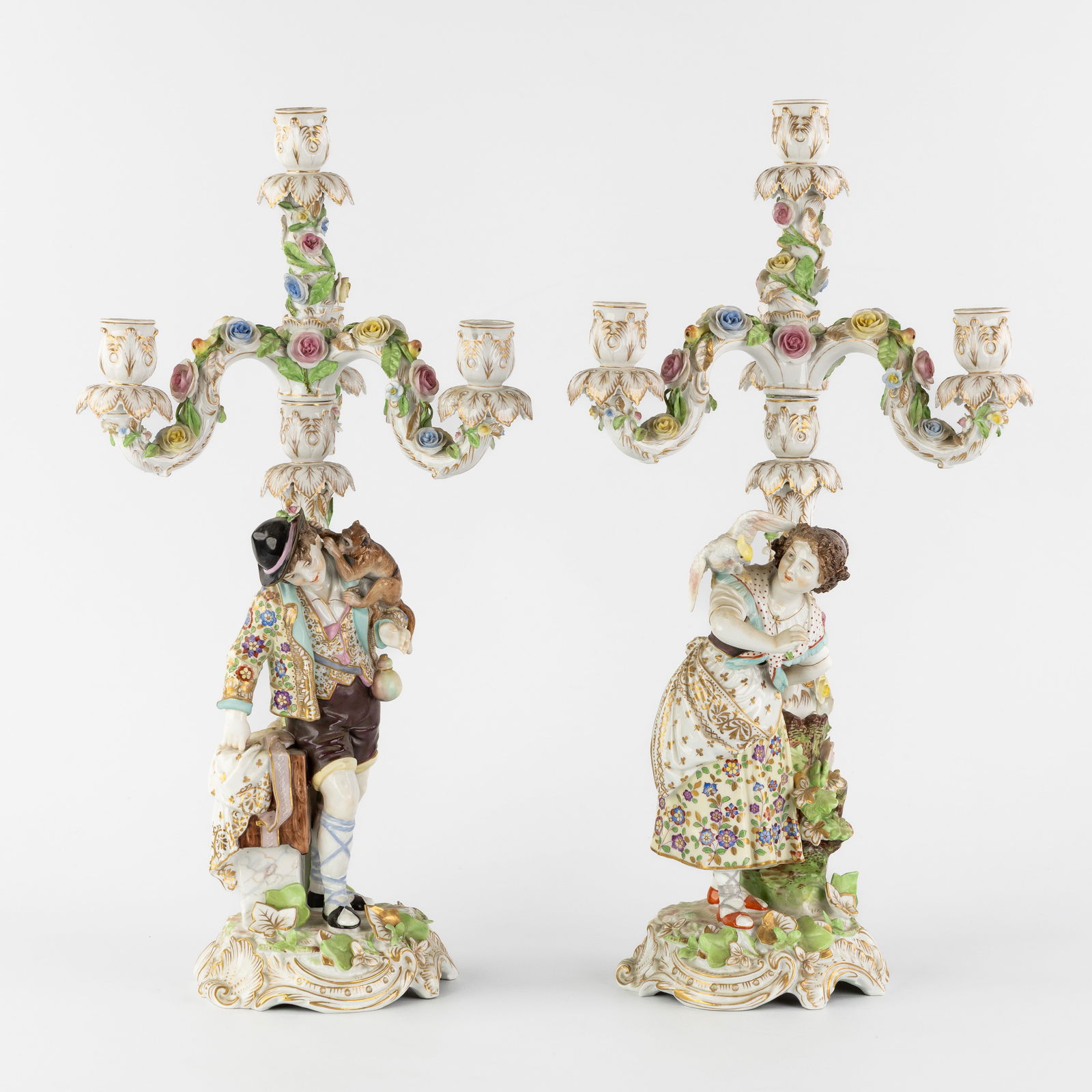 Rudolstadt, A Pair of elegant Candelabra, 'Lady with Parrot' and 'Man with Monkey', polychrome (1 of 7)