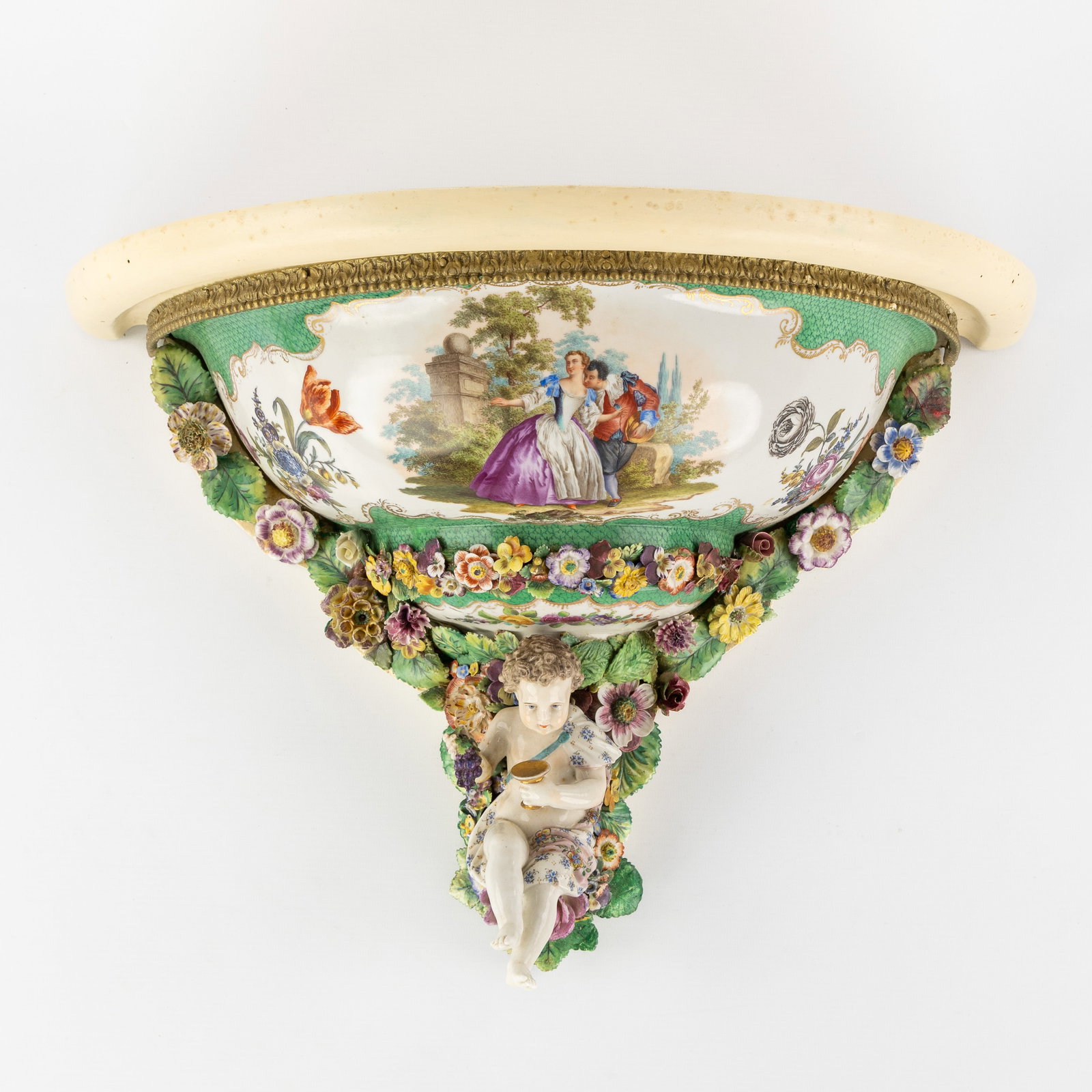 A wall console, polychrome porcelain mounted on wood. Germany, circa 1900.: A wall console, polychrome porcelain mounted on wood. Germany, circa 1900. Polychrome porcelain mounted on wood.