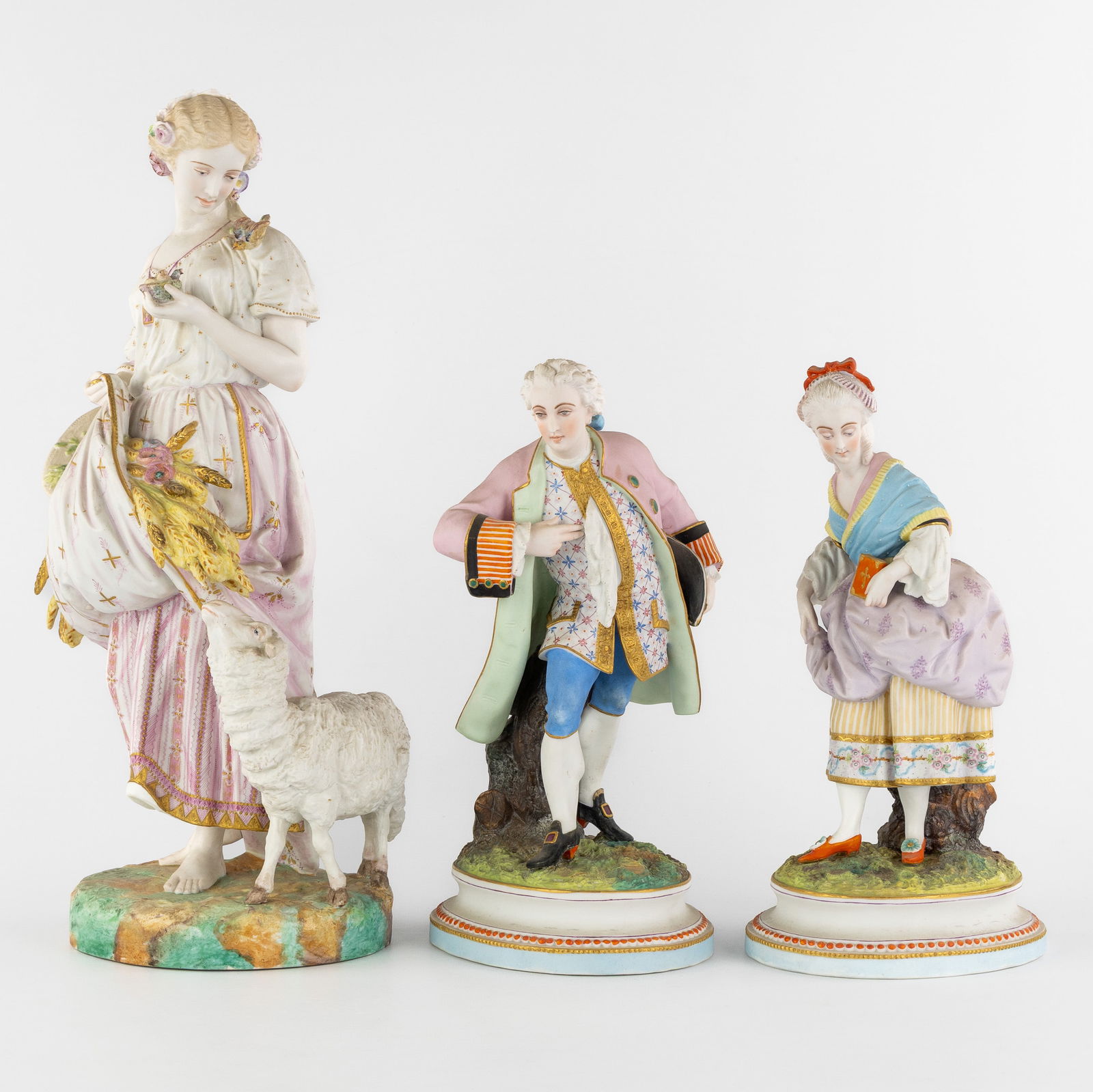 Vion & Baury, a statue 'The Harvest', added are a Noble Man and Woman, Polychrome biscuit porcelain. (1 of 10)