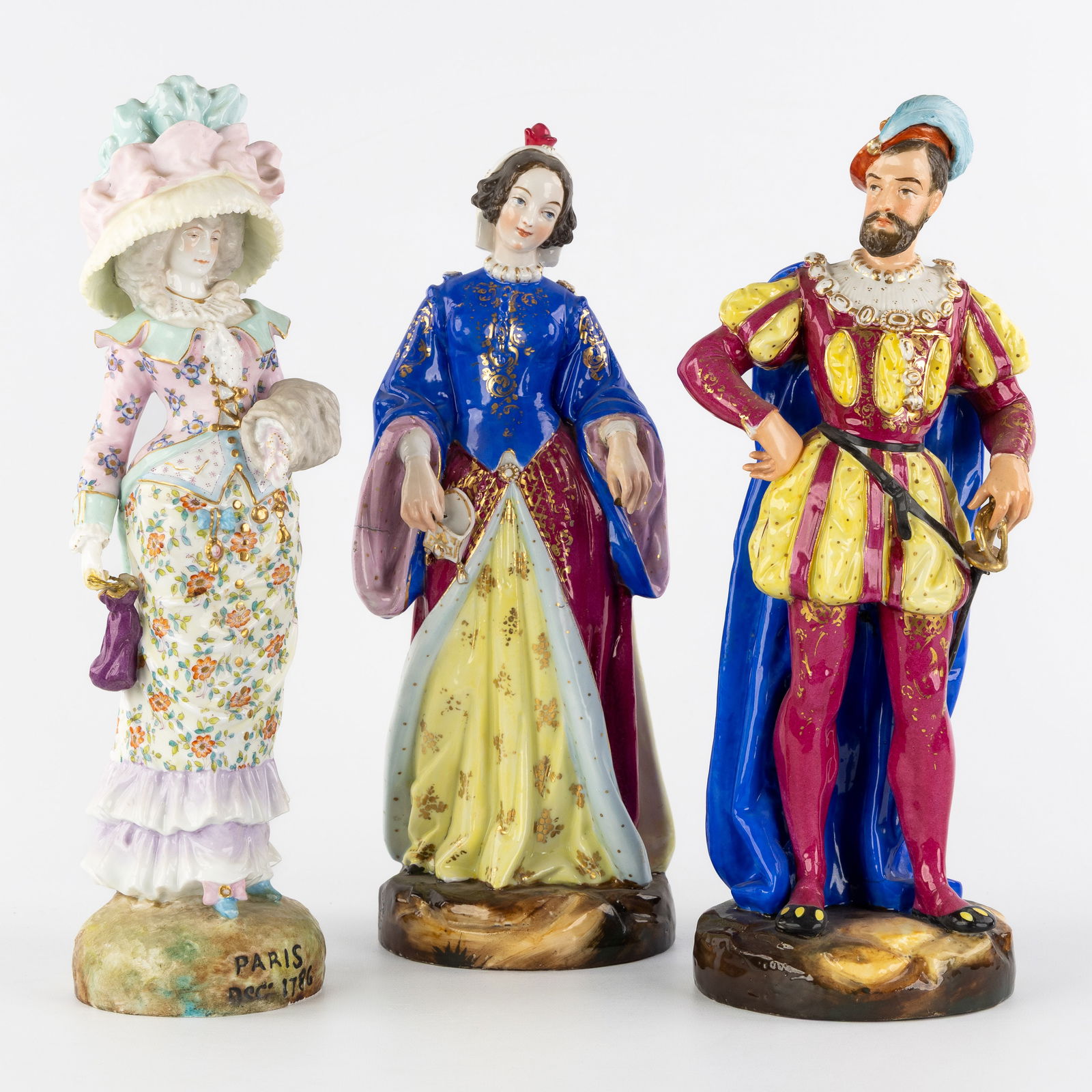 Three porcelain figurines, 'Renaissance Nobleman and Noble Lady' and 'Lady with Large Hat', France, (1 of 9)