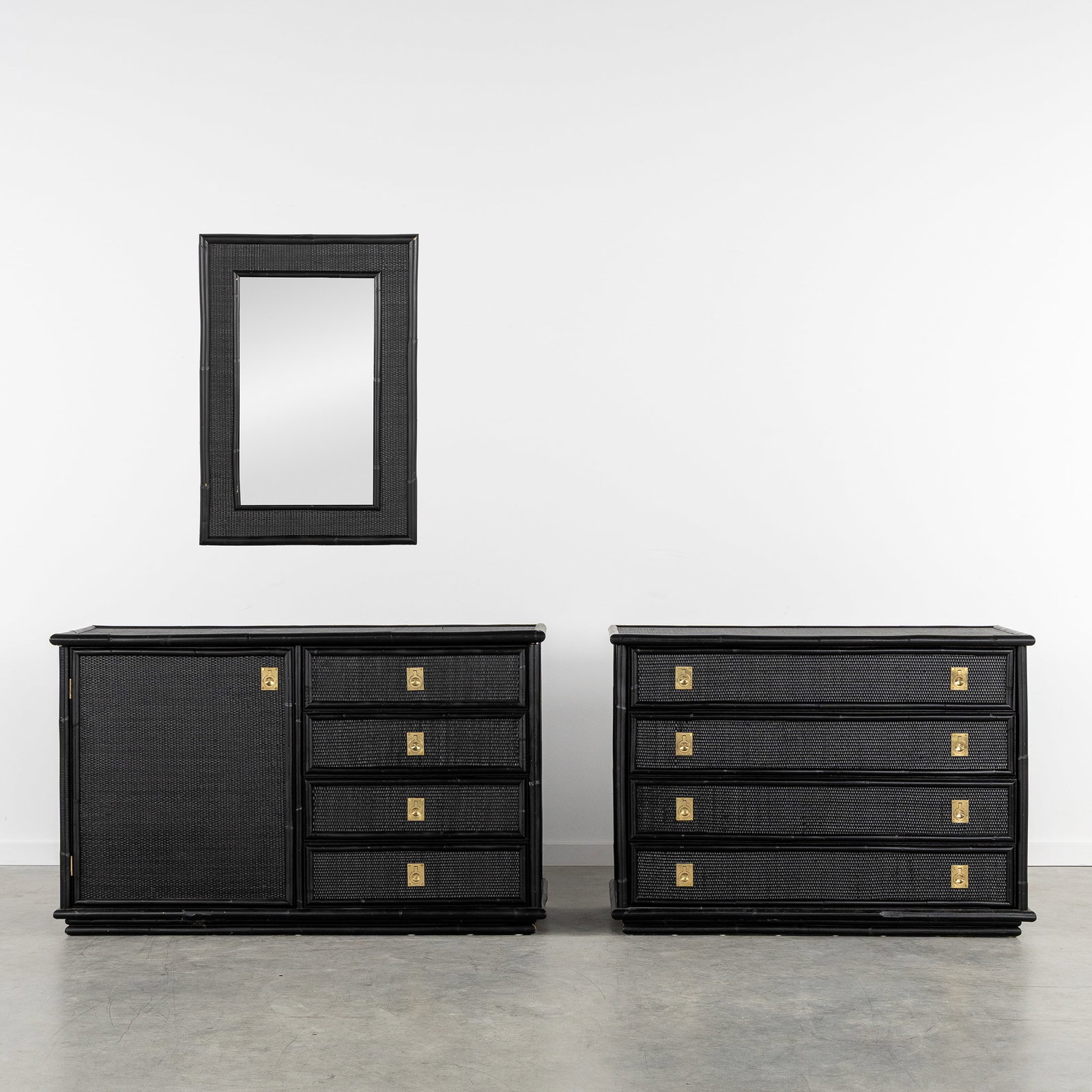 Dal Vera, a Sideboard, a Chest of Drawers and a Mirror, rattan and bamboo, Italy, circa 1960-1970.: Dal Vera, a Sideboard, a Chest of Drawers and a Mirror, rattan and bamboo, Italy, circa 1960-1970. Black patinated rattan and bamboo.Finished with brass hardware.Sideboard or dresser, with a single-