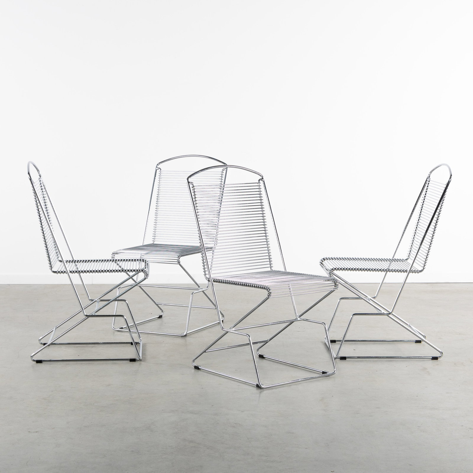 Till Behrens (1931) 'Kreuzschwinger', a set of four wire chairs, Germany, circa 1980-1990. (1 of 6)