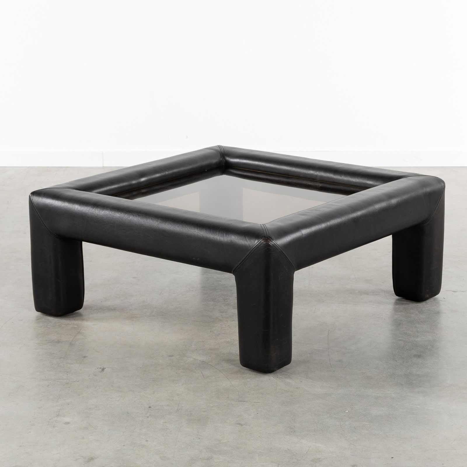 De Sede, A Mid-Century coffee table, leather and tinted glass. Switzerland, circa 1970. (1 of 8)