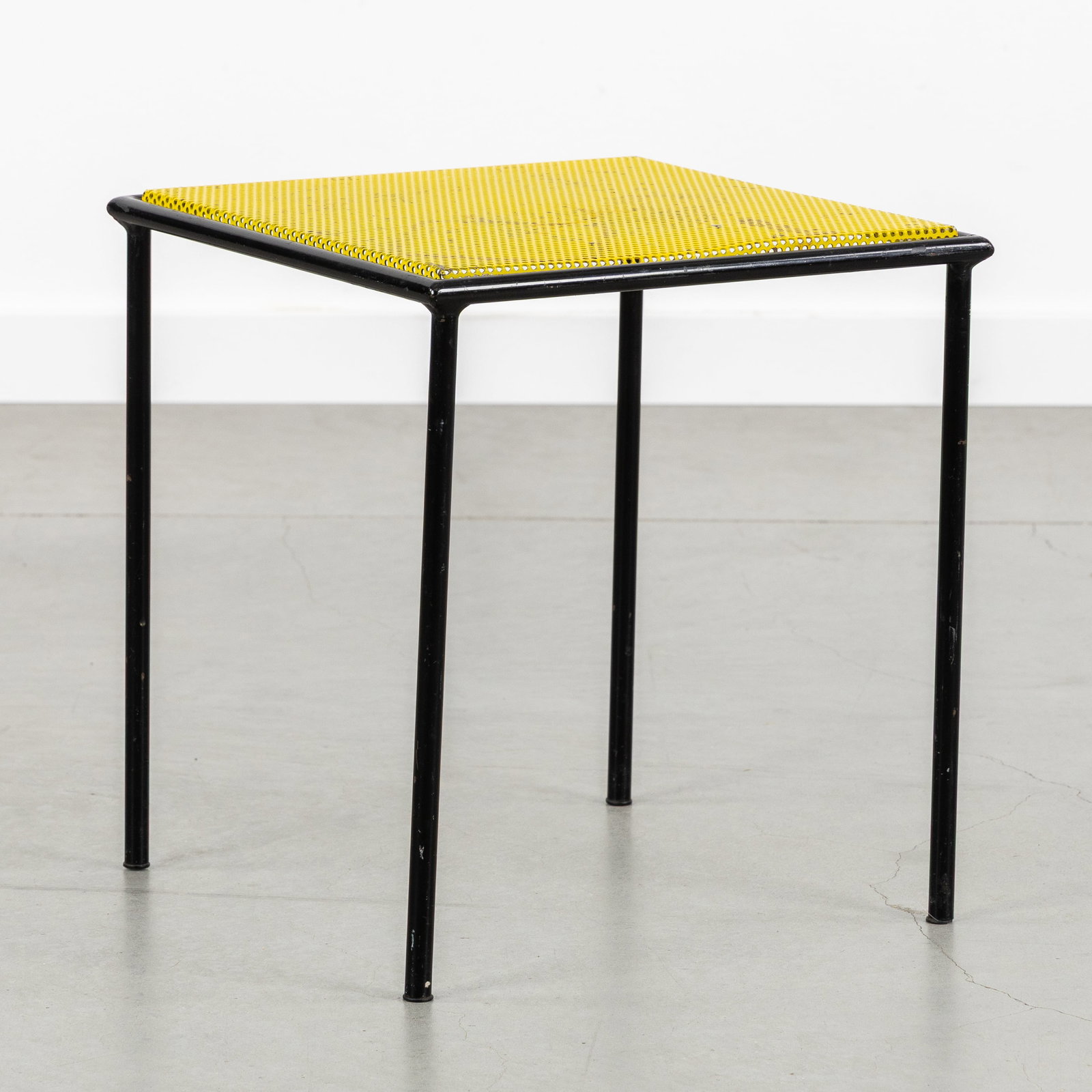 Floris Fiedeldij (XX) a side table, for Artimeta, patinated and perforated metal, circa 1960.: Floris Fiedeldij (XX) a side table, for Artimeta, patinated and perforated metal, circa 1960. Patinated metal (black and yellow).Design by Floris Fiedeldij, for Artimeta.Netherlands, circa 1960.