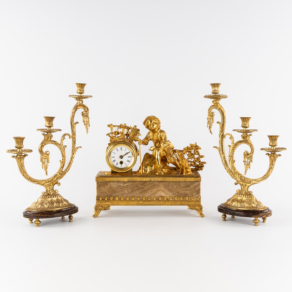 A Three-piece Mantel Garniture, Clock and Candelabra, decorated with a Shepherd Boy, gilded brass (1 of 8)