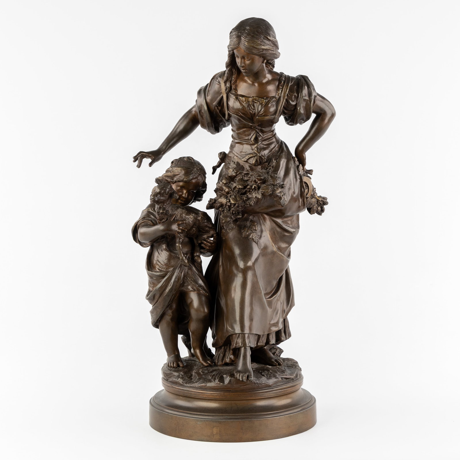 Auguste Moreau (1834-1917) 'The Grape Harvest', patinated spelter.: Auguste Moreau (1834-1917) 'The Grape Harvest', patinated spelter. Patinated spelter.Signed 'Auguste Moreau'.Depicting a young woman with a pouch full of grapevines and a sickle, and a boy with a la