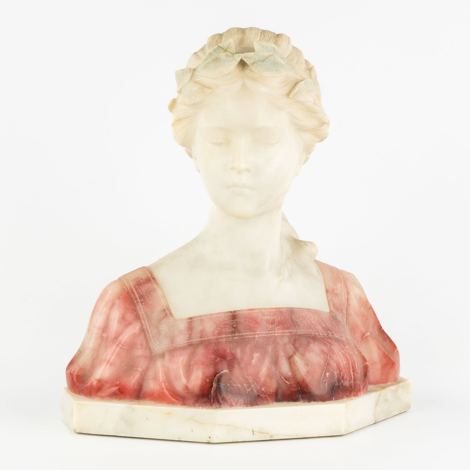 A Bust of a Young Lady, multicoloured alabaster, signed Nelson.: A Bust of a Young Lady, multicoloured alabaster, signed Nelson. (37 x 40 x 20 cm)