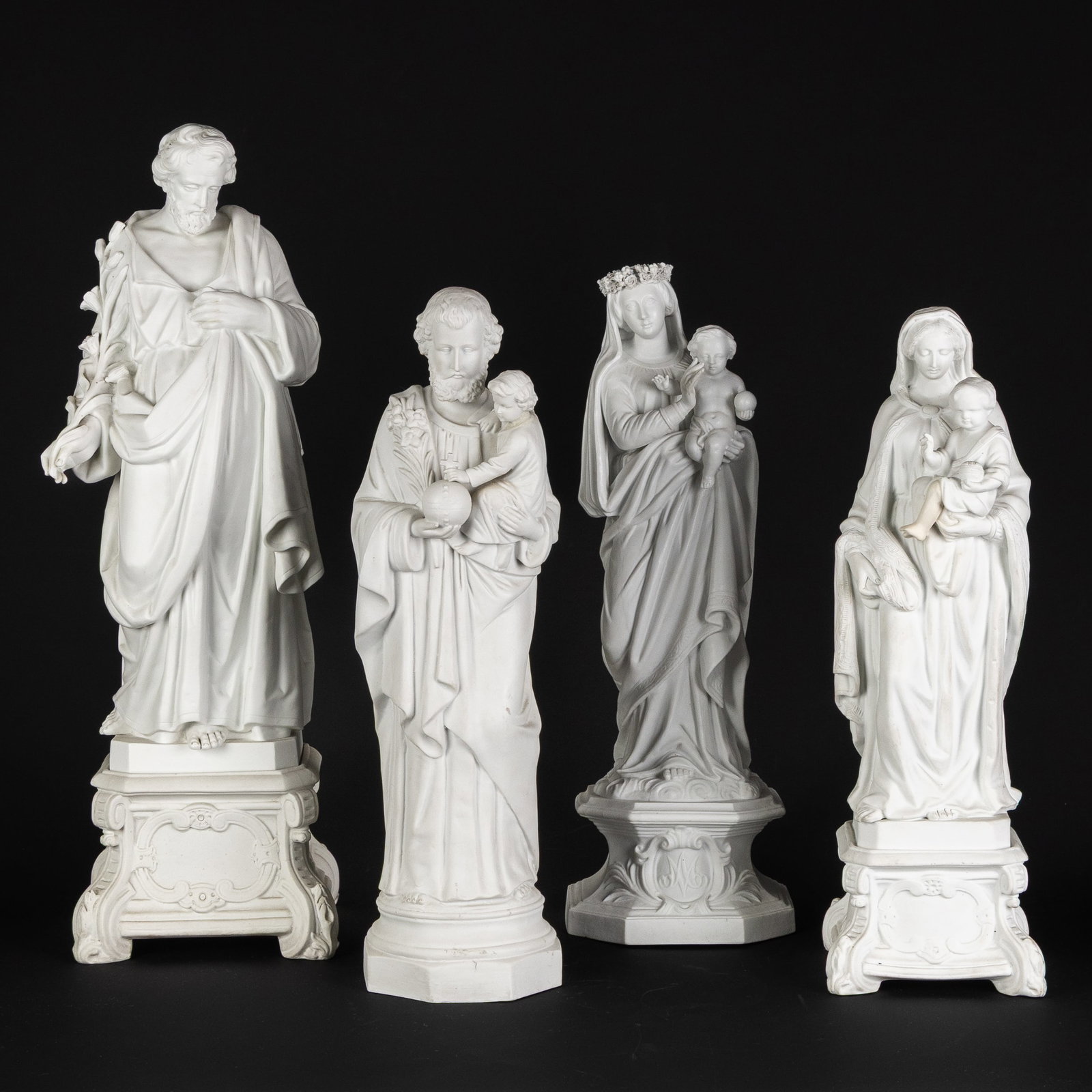 Madonna and Child, Saint Joseph and Child, and Saint Joseph, four biscuit porcelain statues. (1 of 9)