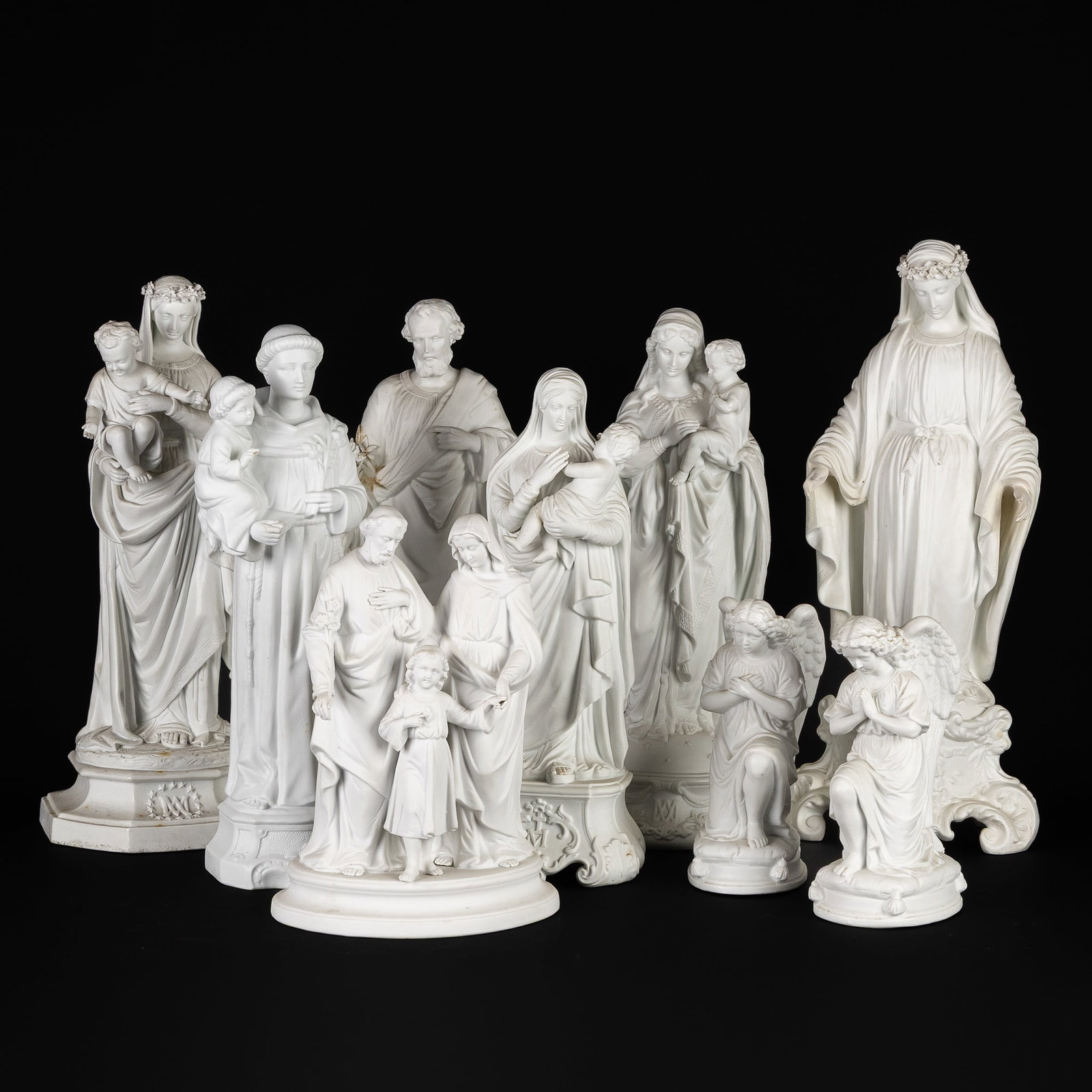 A Collection of 9 saint figurines, biscuit porcelain. (1 of 5)