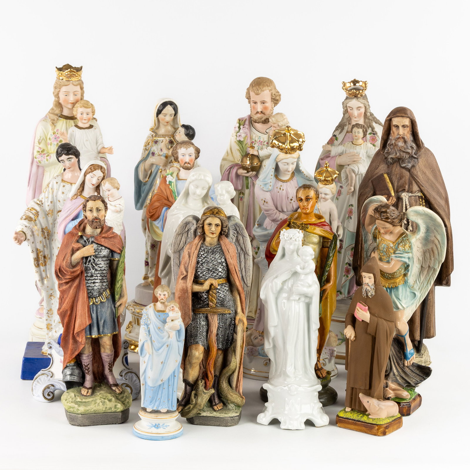 A Collection of 17 saint statues, porcelain and biscuit porcelain, patinated stoneware and plaster. (1 of 8)
