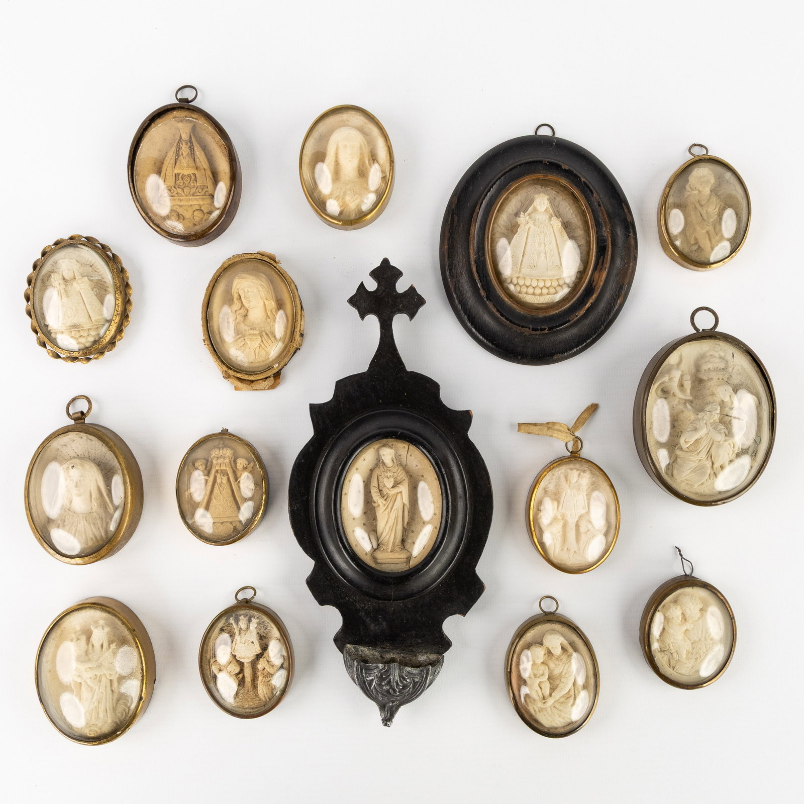 A Collection of 15 small frames/pendants and a holy water font with Religious Scenes, Meerschaum or (1 of 6)