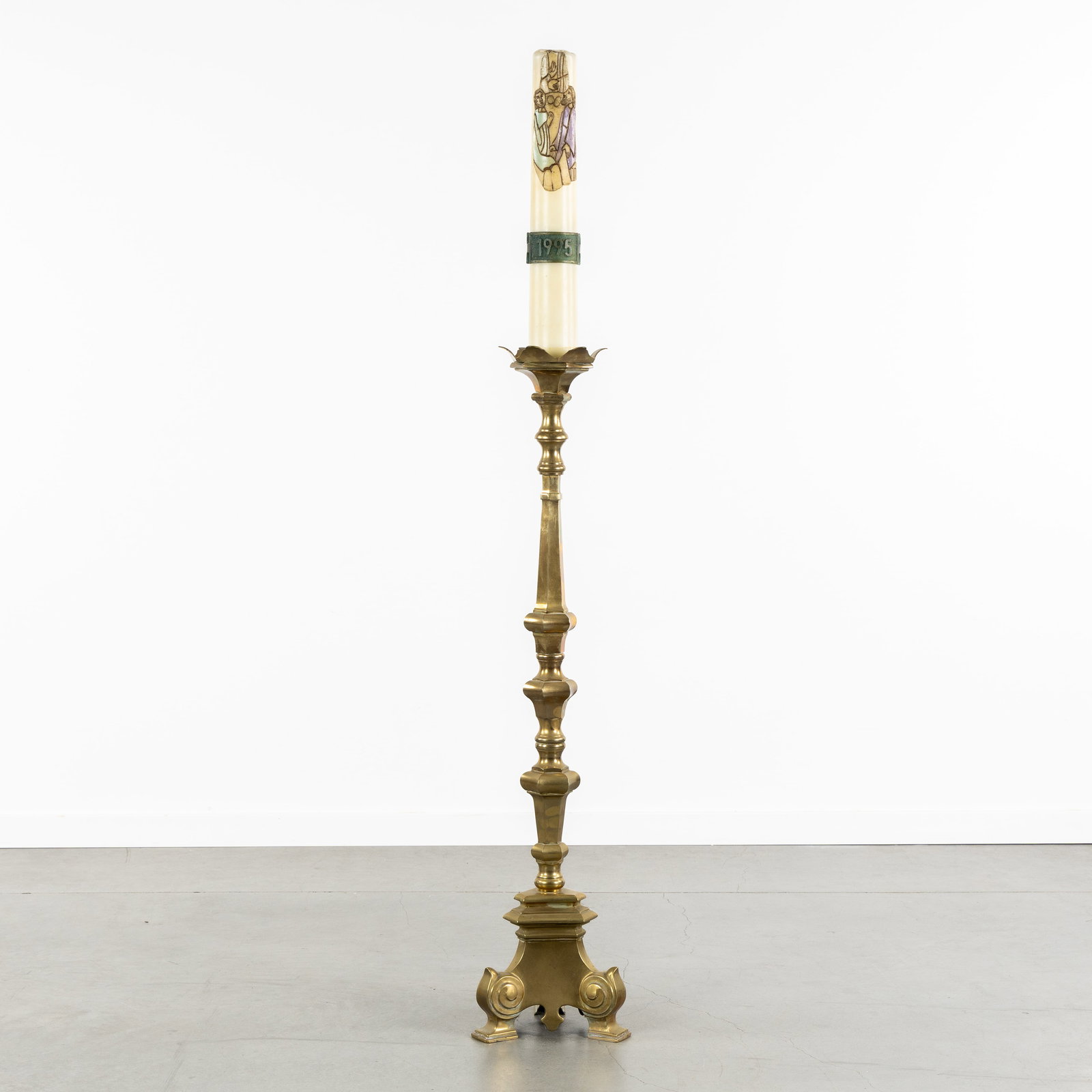 A Large bronze church candlestick with Easter candle. (1 of 6)