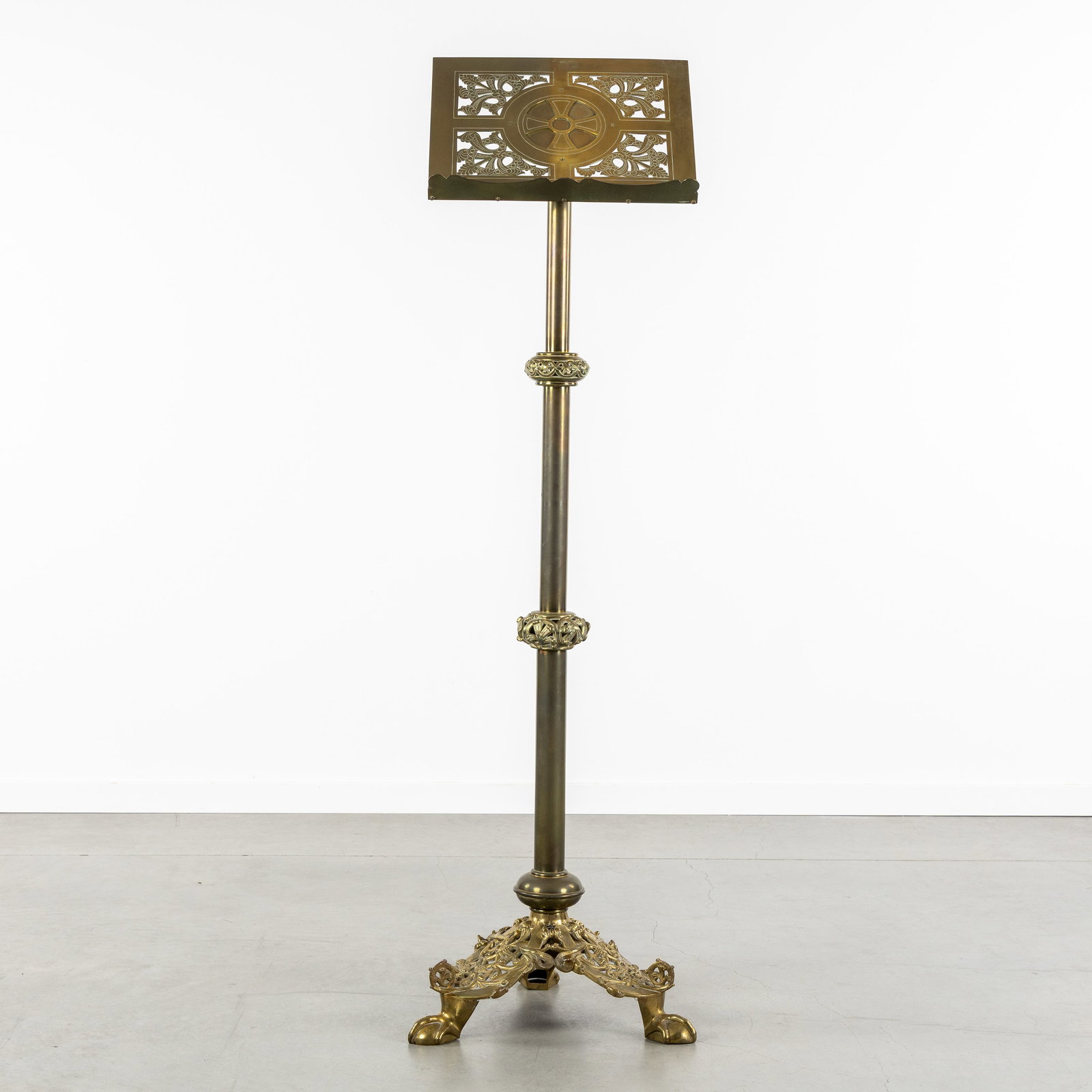 A Large antique lectern, patinated and gilded bronze, decorated with openwork. (1 of 7)
