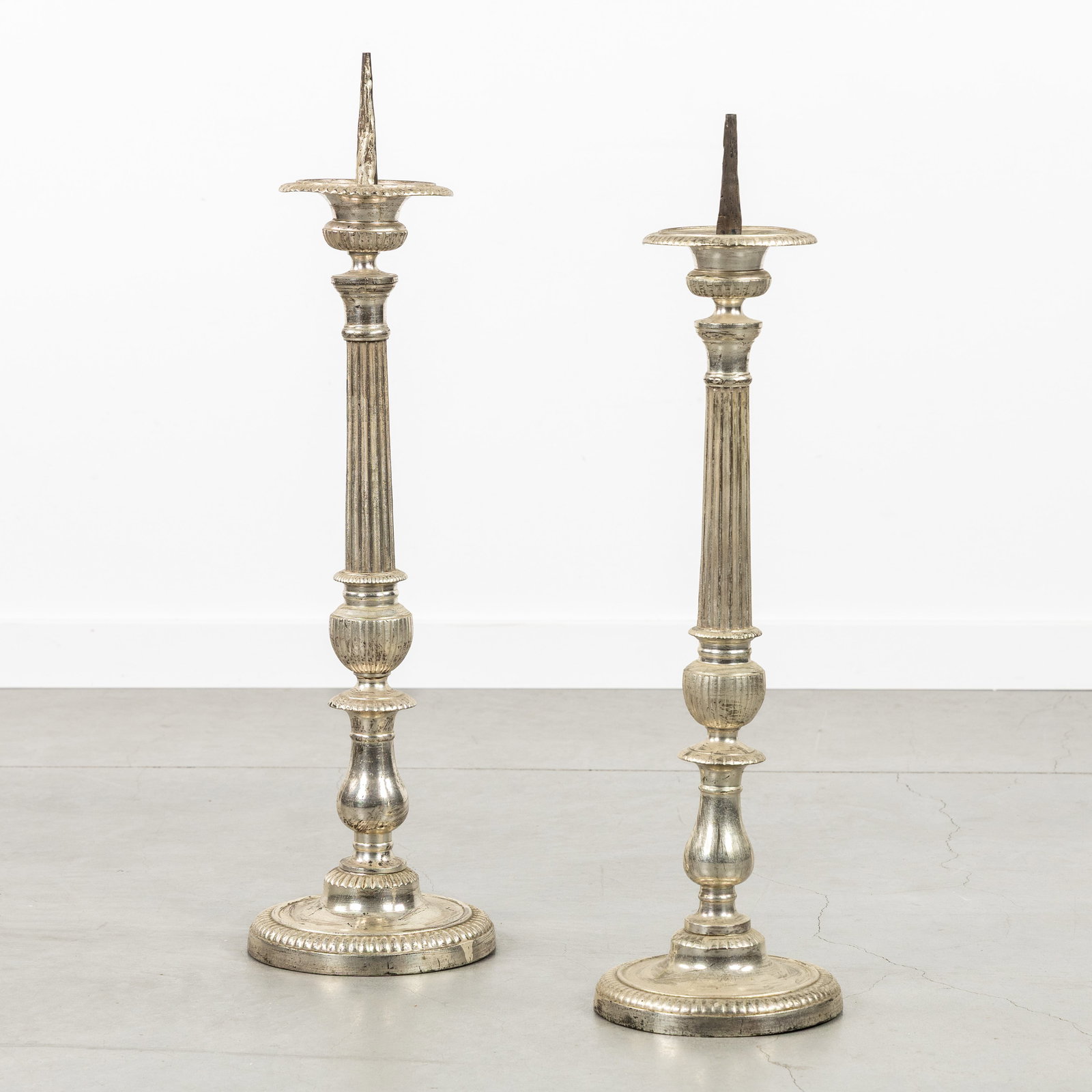 A Near pair of Neoclassical church candlesticks, silver-plated brass. (1 of 4)