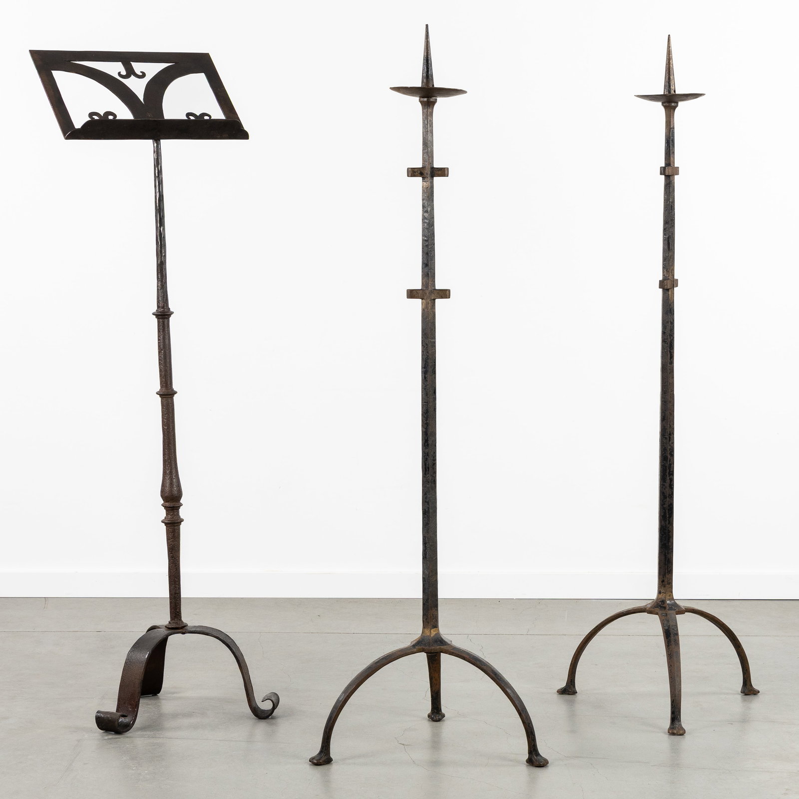 An Antique wrought iron lectern with two matching candlesticks. (1 of 7)