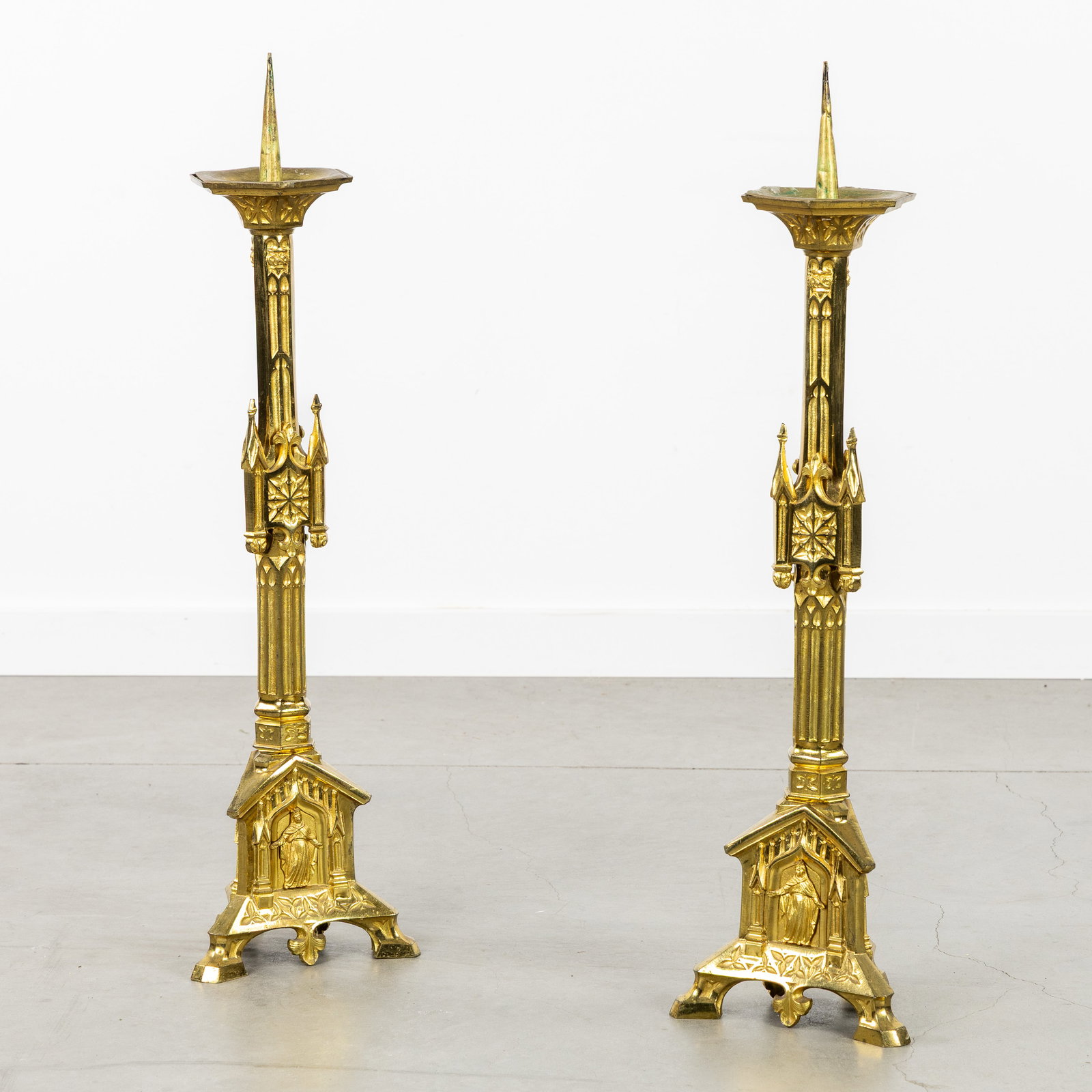A Pair of Gothic Revival church candlesticks, with Jesus Christ, Crowned Virgin Mary, and Saint: A Pair of Gothic Revival church candlesticks, with Jesus Christ, Crowned Virgin Mary, and Saint Philomena, gilded brass. Gilded brass.Architectural church candlesticks, decorated with pinnacles and ba