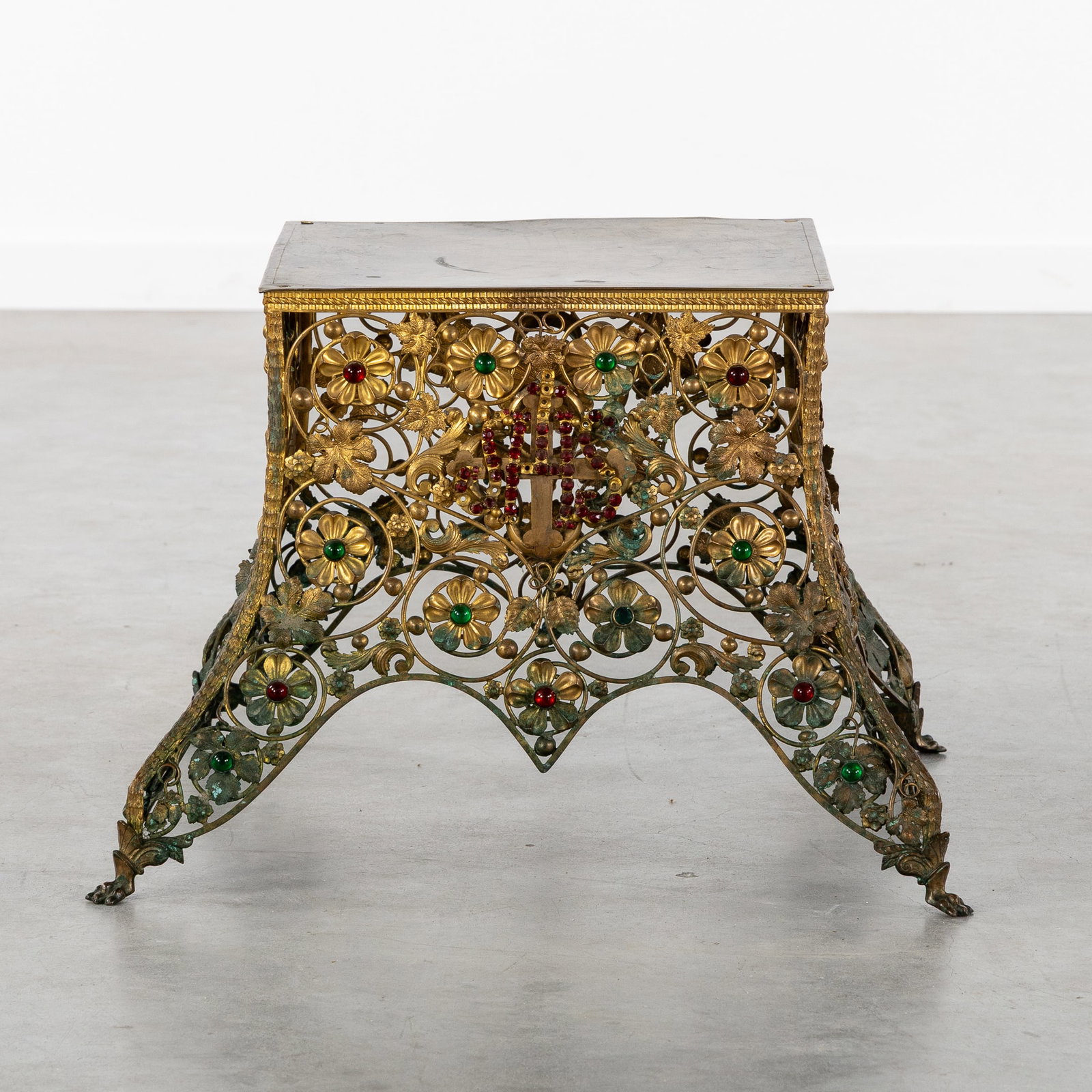 A Gothic Revival Tabor or Monstrance Base, Brass, finished with an IHS Monogram and Cabochons.: A Gothic Revival Tabor or Monstrance Base, Brass, finished with an IHS Monogram and Cabochons. Gothic Revival. Brass.Tabor or monstrance base.Decorated with openwork floral scrolls and vines, and an