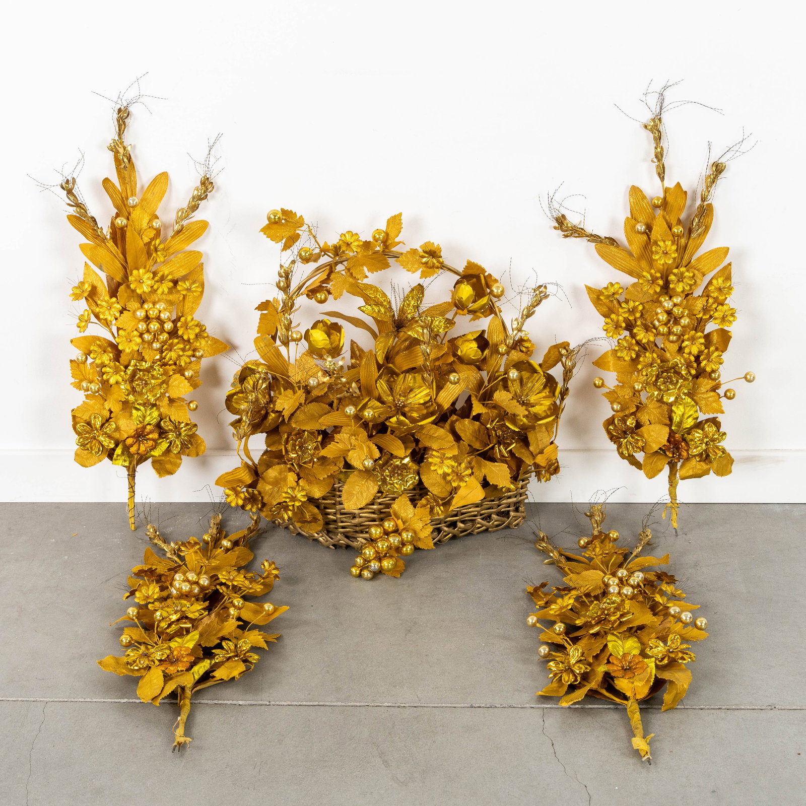 A flower basket with bouquets, featuring gold-plated metal, fabric and paper. (1 of 5)