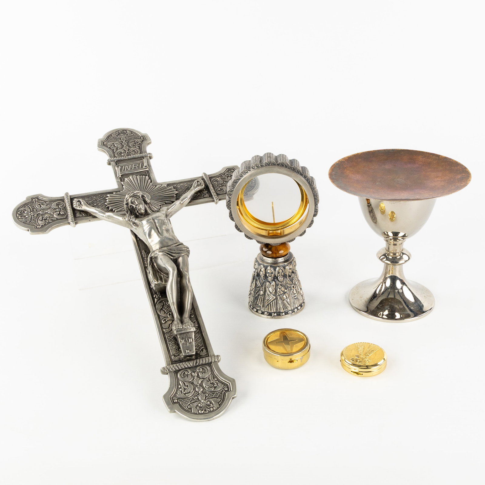 A collection of liturgical vessels, a chalice, a monstrance, ciboria and a crucifix. (1 of 16)