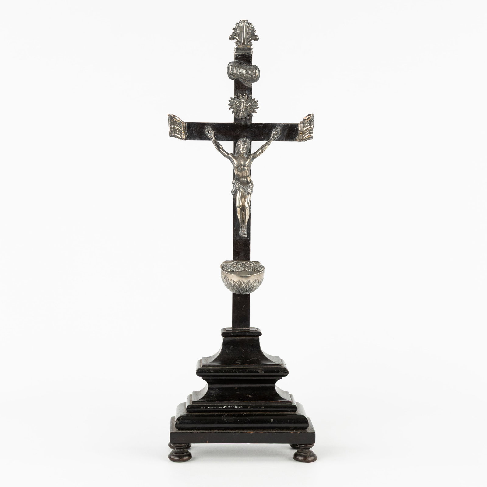 An Antique altar crucifix with silver Corpus Christi and Holy water font, Baroque style.: An Antique altar crucifix with silver Corpus Christi and Holy water font, Baroque style. Ebonized wood and silver.Altar crucifix mounted with silver Corpus Christi, INRI banner, Holy Spirit (dove), an