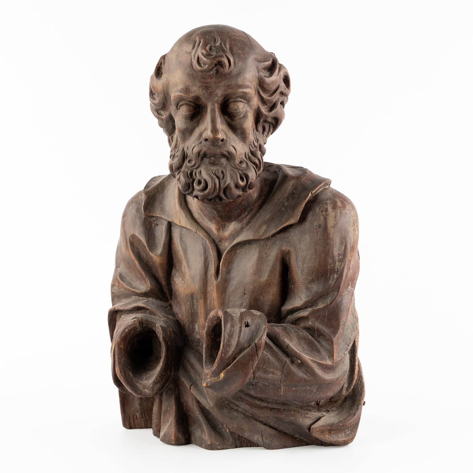 A Wood-sculptured Bust of Saint Peter, 18th/19th C.: A Wood-sculptured Bust of Saint Peter, 18th/19th century. Sculptured wood, with traces of polychromy. Bust of probably Saint Peter. (36 x 54 x 24 cm)