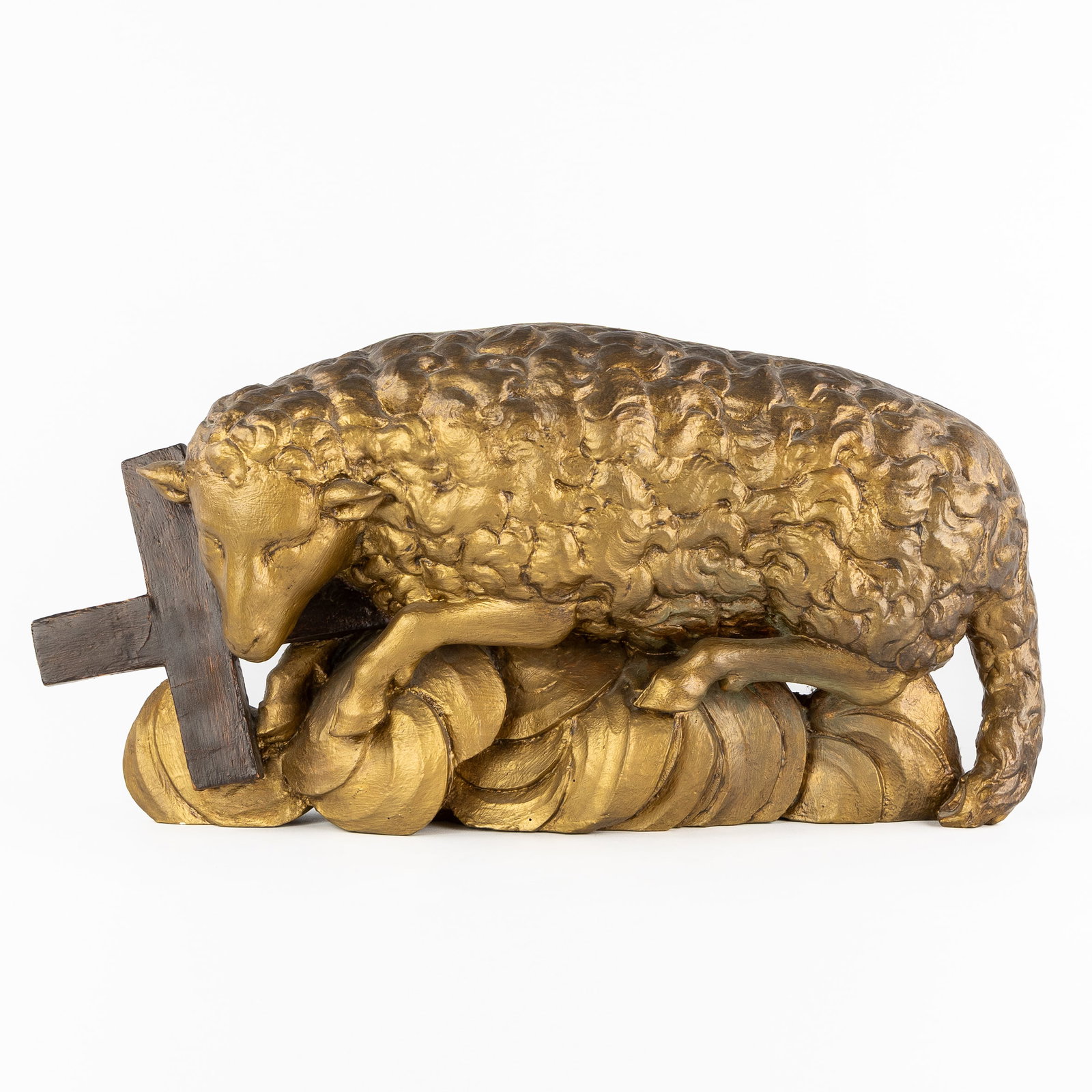 Agnus Dei, Lamb of God, a Gothic Revival wood-sculptured and gilded statue, 19th C.: Agnus Dei, Lamb of God, a Gothic Revival wood-sculptured and gilded statue, 19th century. Sculptured, patinated, and gilded wood.Representation of the Lamb of God, Agnus Dei.