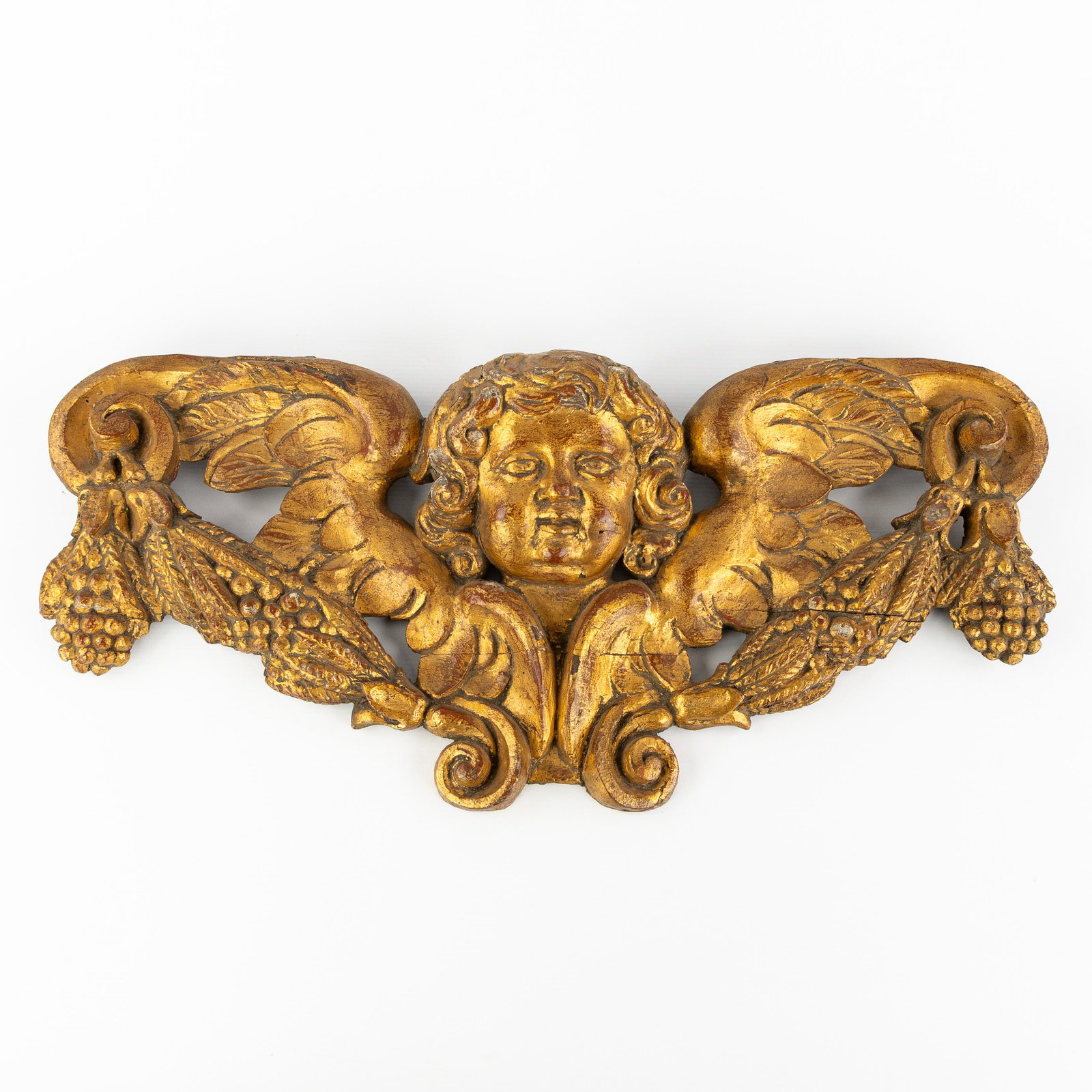 A gilt and wood-sculptured bas relief of an Angel figurine, 19th C. (1 of 5)