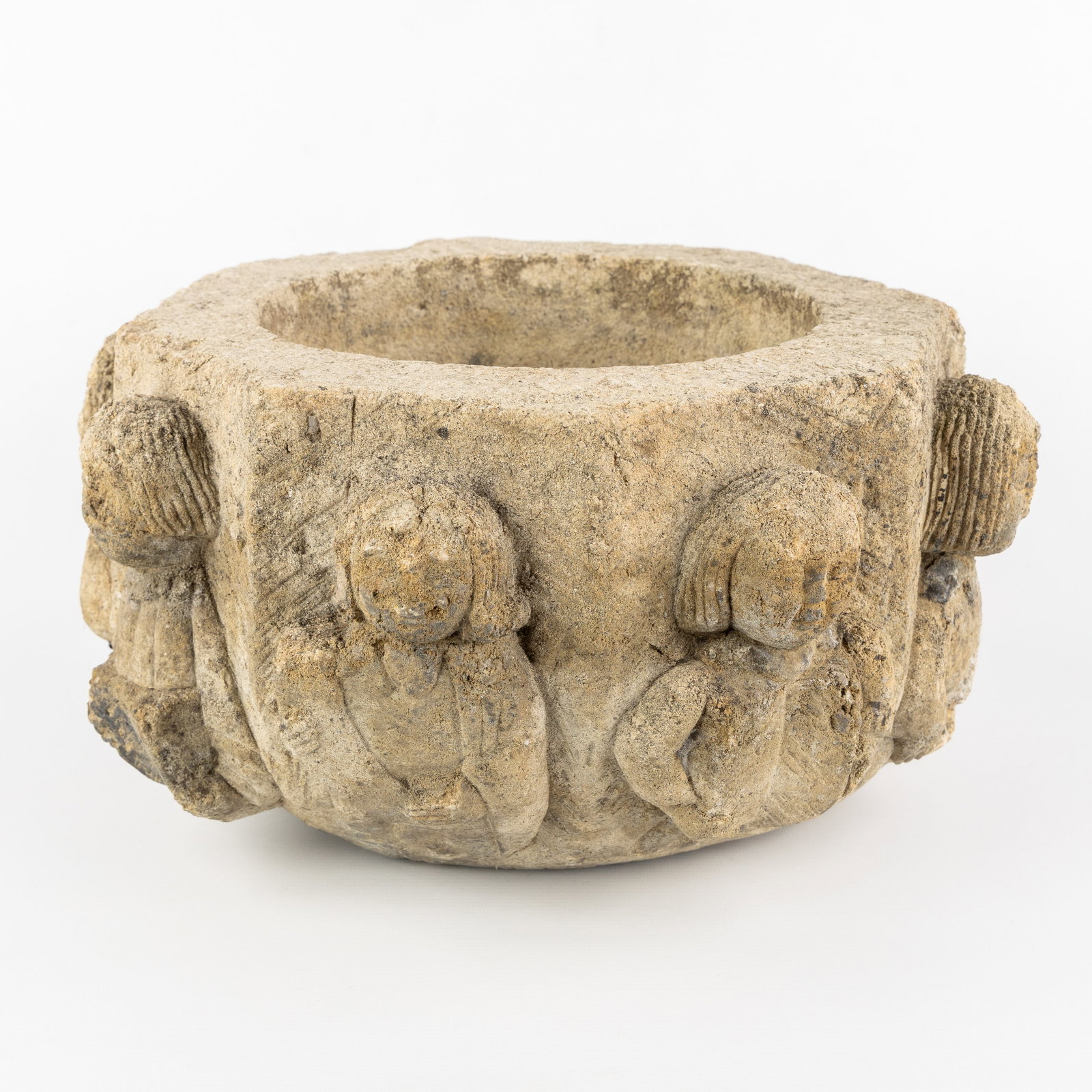 An Ancient holy water font or baptismal font, decorated with eight 'Apostle figures', sculptured (1 of 7)