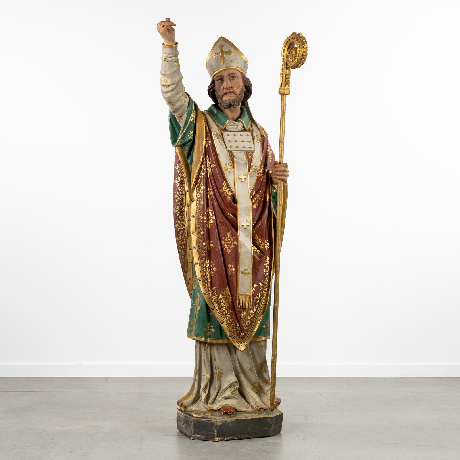 Saint Nicholas, a patinated terracotta statue, Gothic Revival.: Saint Nicholas, a patinated terracotta statue, Gothic Revival. Patinated terracotta, with wood-sculptured staff. Northwest Europe. (60 x 163 x 34 cm)
