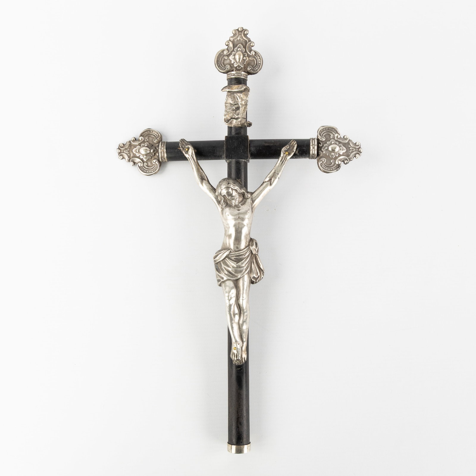 An Ebonised wooden crucifix with silver Corpus Christi. (1 of 3)