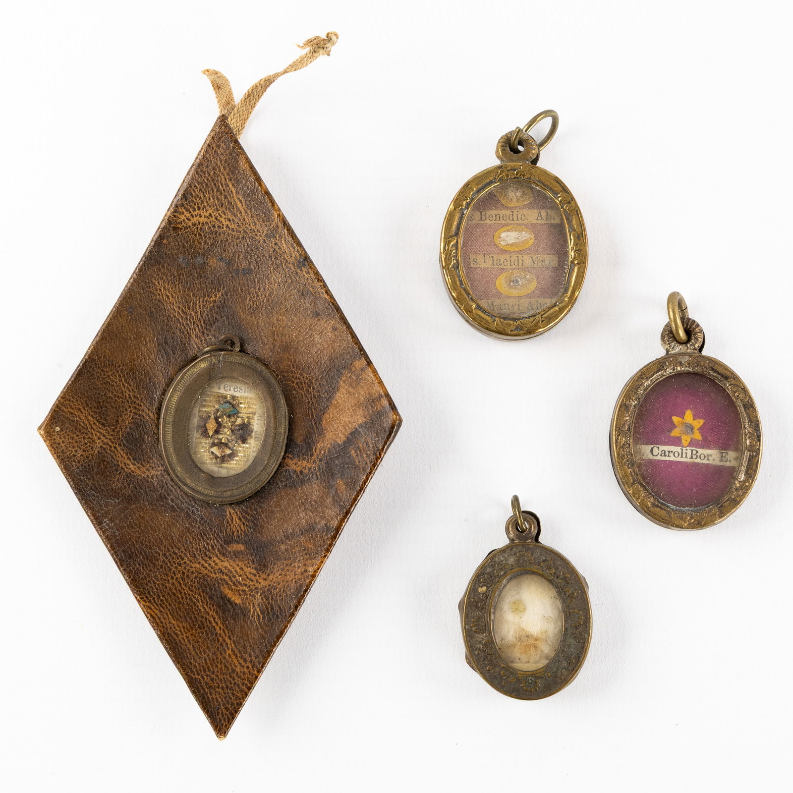 Three Sealed theca with relics of Saints, and a Reliquary holder with the Agnus Dei. (1 of 3)